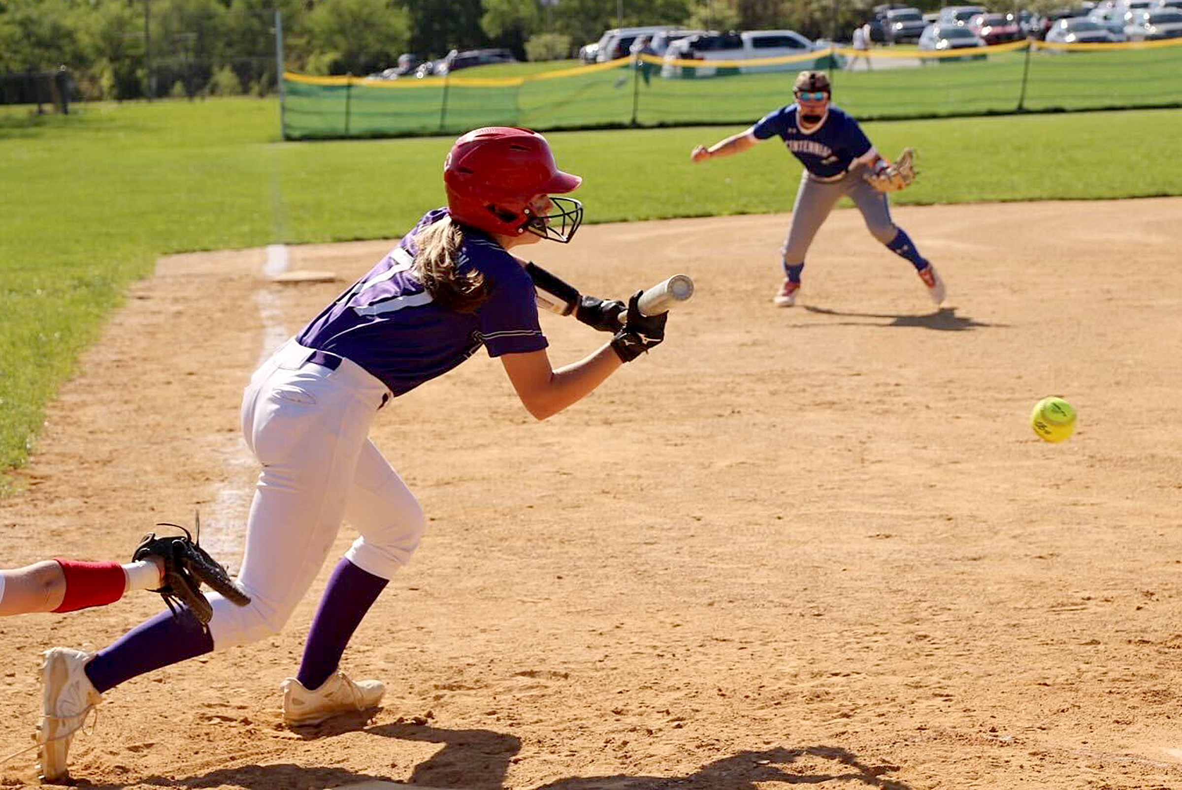 Long Reach’s Abby Richardson lays down a bunt single in...