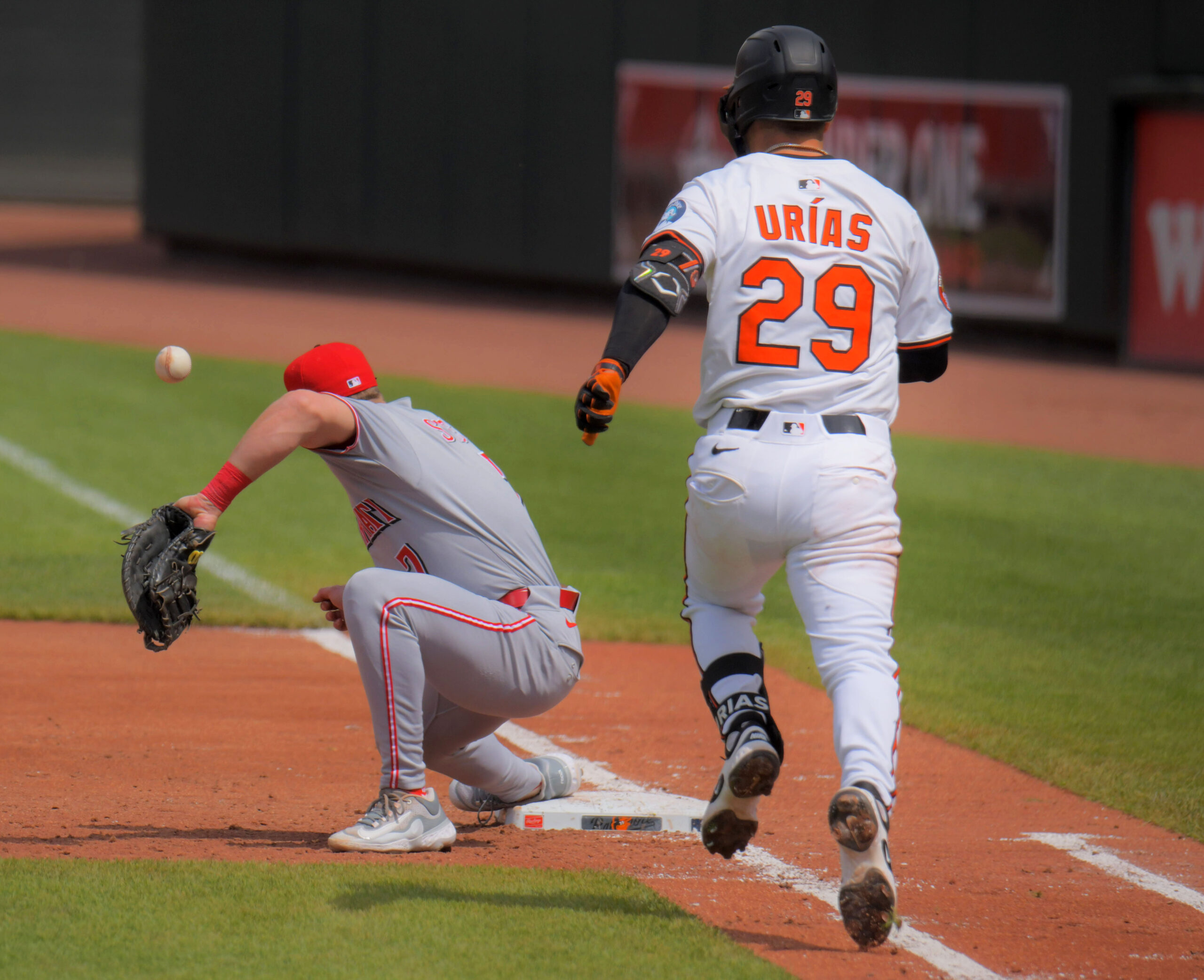 A throw by Cincinnati Reds third baseman Noelvi Marte skips...