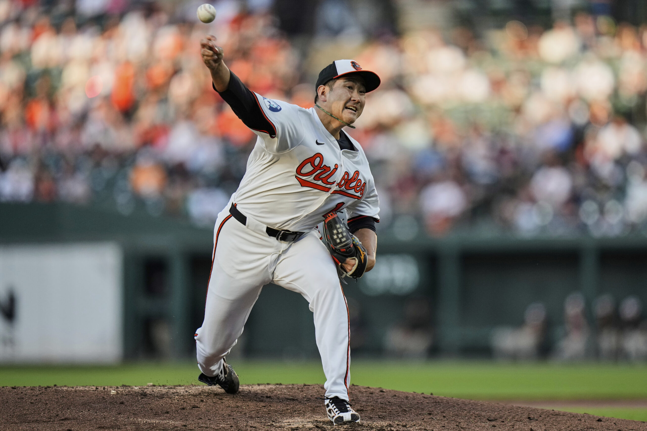 Baltimore Orioles starting pitcher Tomoyuki Sugano delivers during the second...
