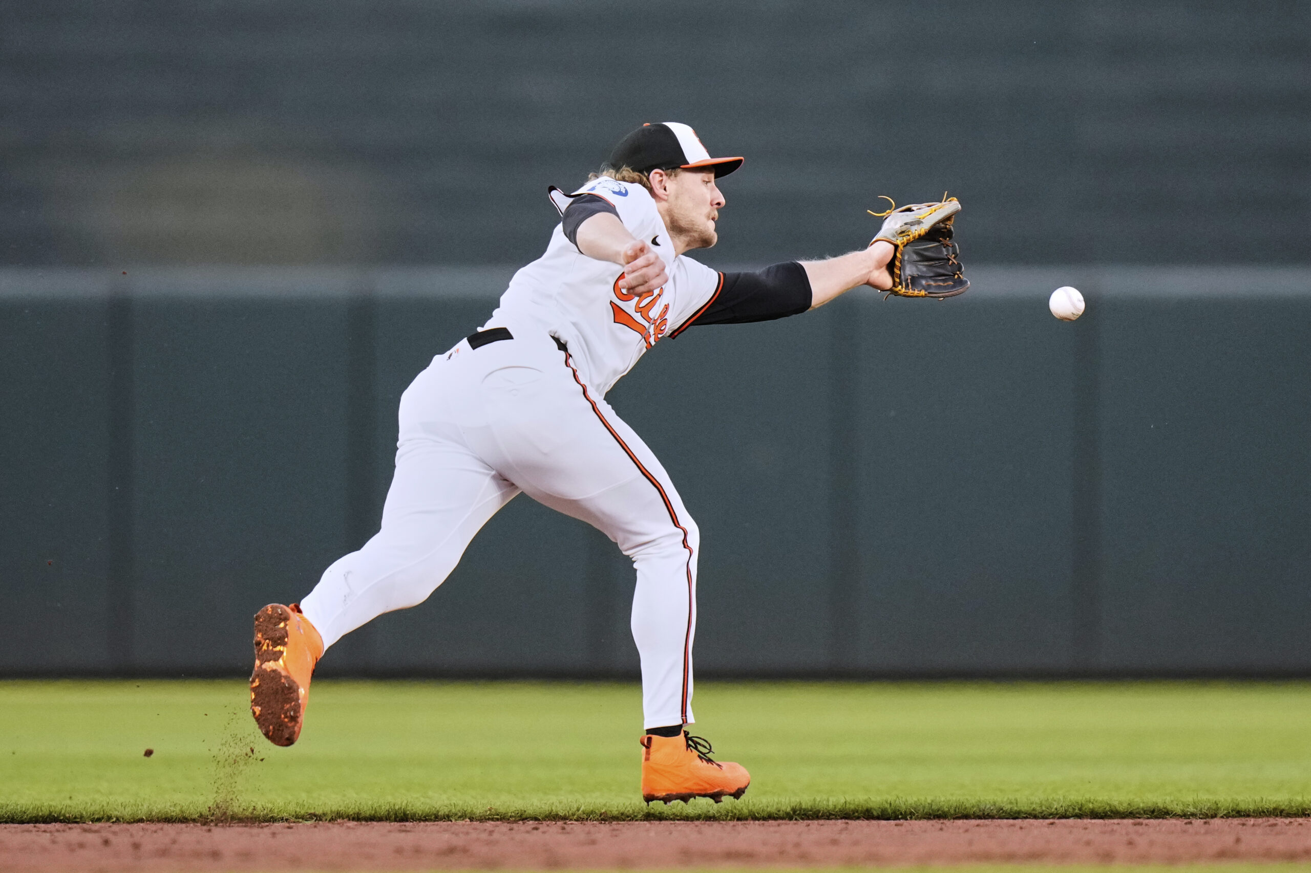 Baltimore Orioles shortstop Gunnar Henderson is unable to stop a...
