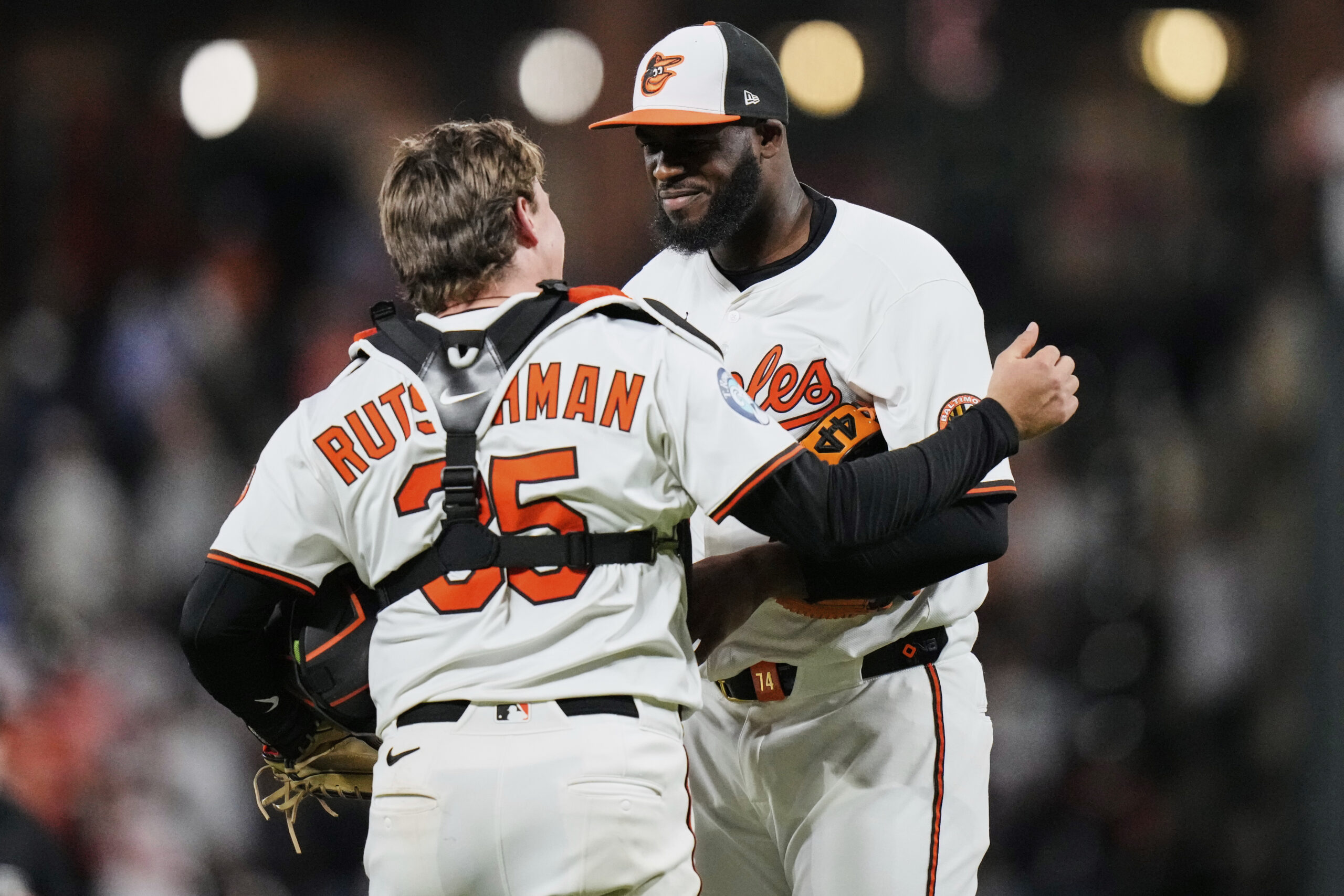 Baltimore Orioles relief pitcher Felix Bautista, right, and catcher Adley...