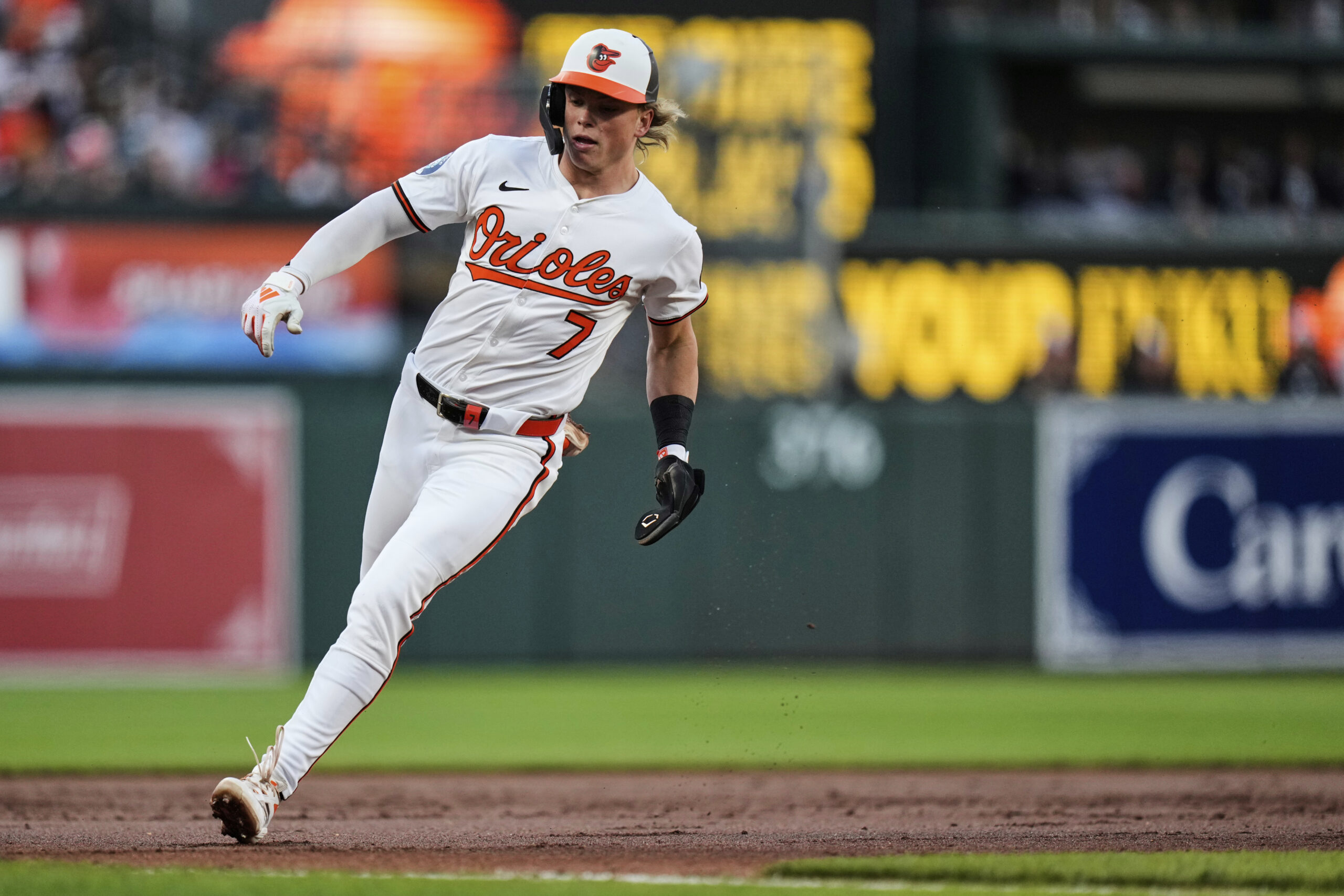 Baltimore Orioles' Jackson Holliday advances to home plate to score...