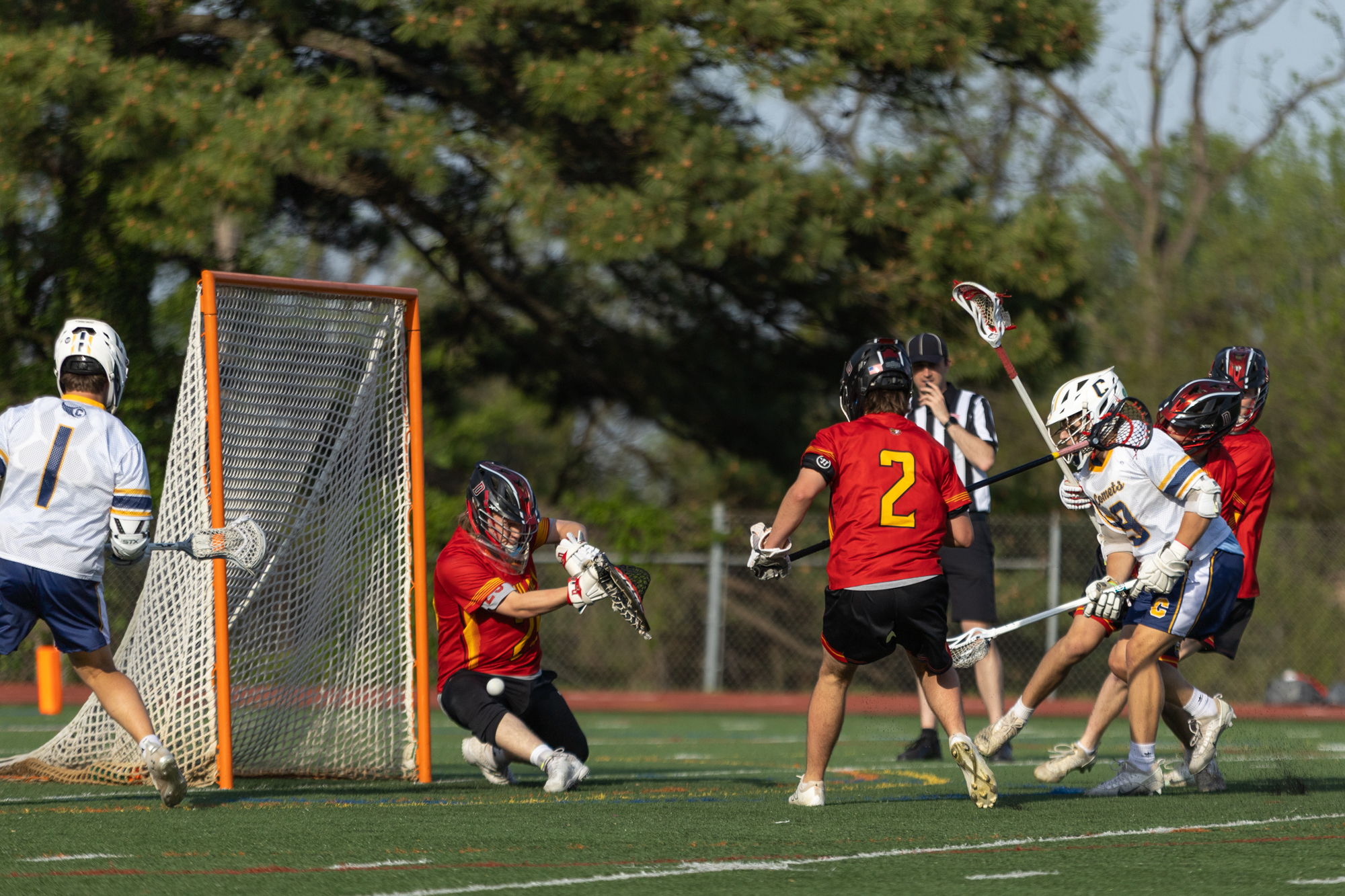 Catonsville’s Colin Fox sneaks a low shot past Dulaney goaltender...