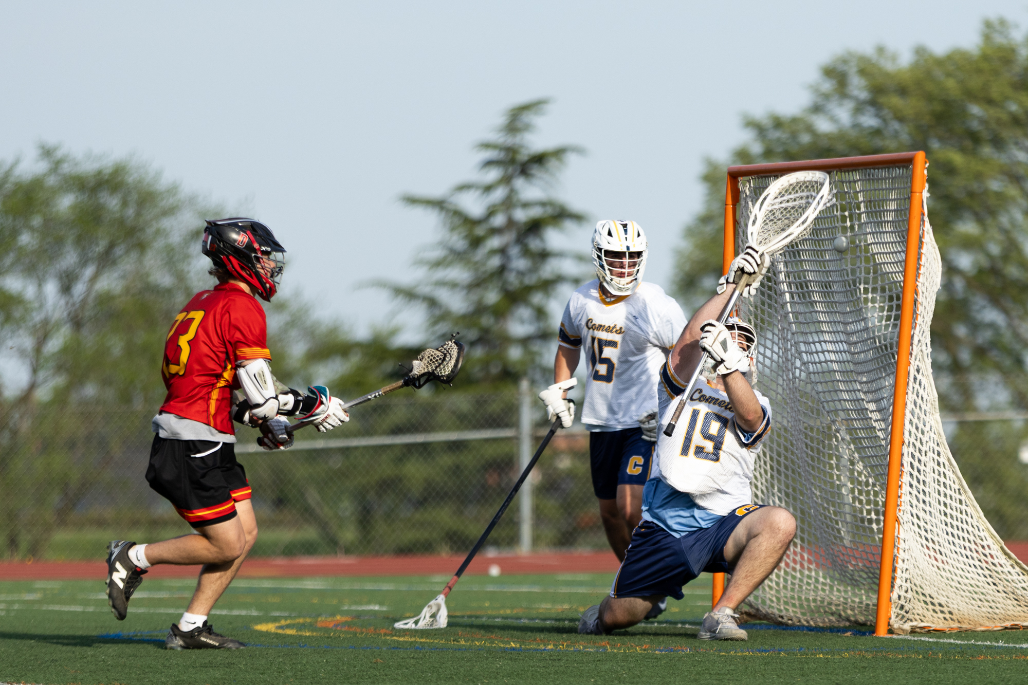 Dulaney’s Constantine Bellios fires a shot past Catonsville goaltender Rory...
