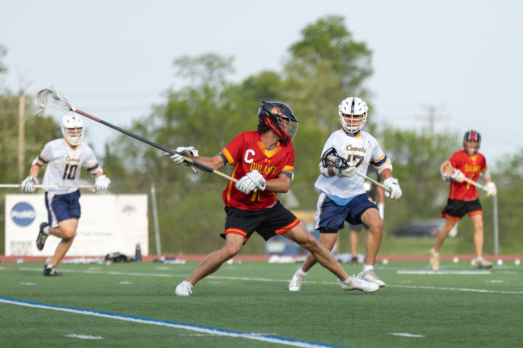Dulaney’s Max Cooper fires off a deep shot in the...