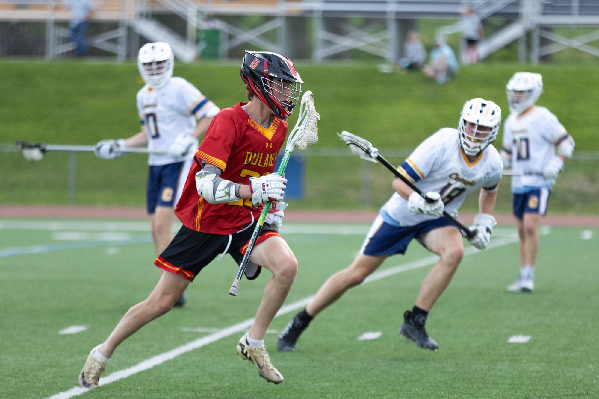 Dulaney’s Jeff Ackerman carries the ball downfield during the game...
