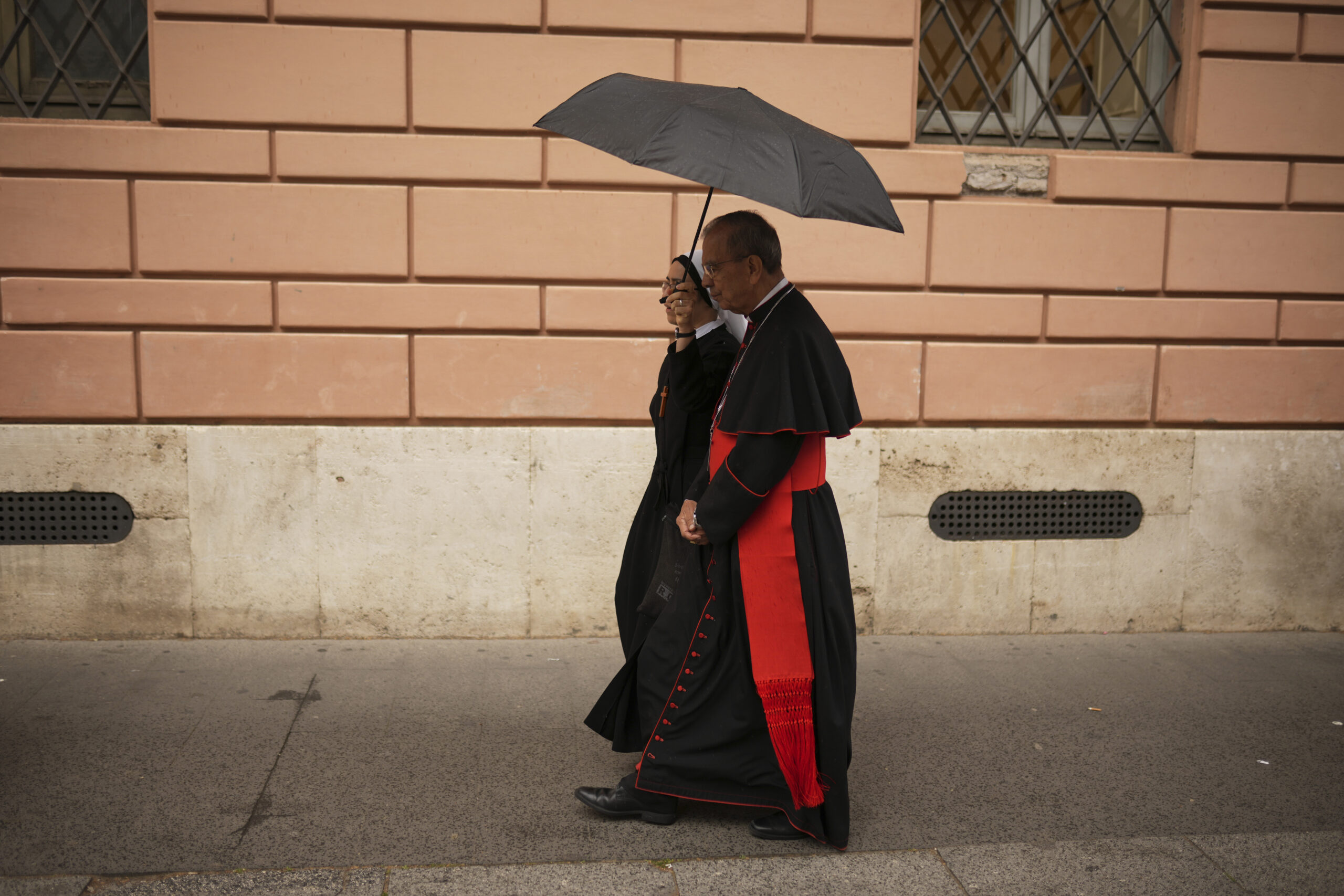 Cardinal Gregorio Rosa Chávez walks before the conclave