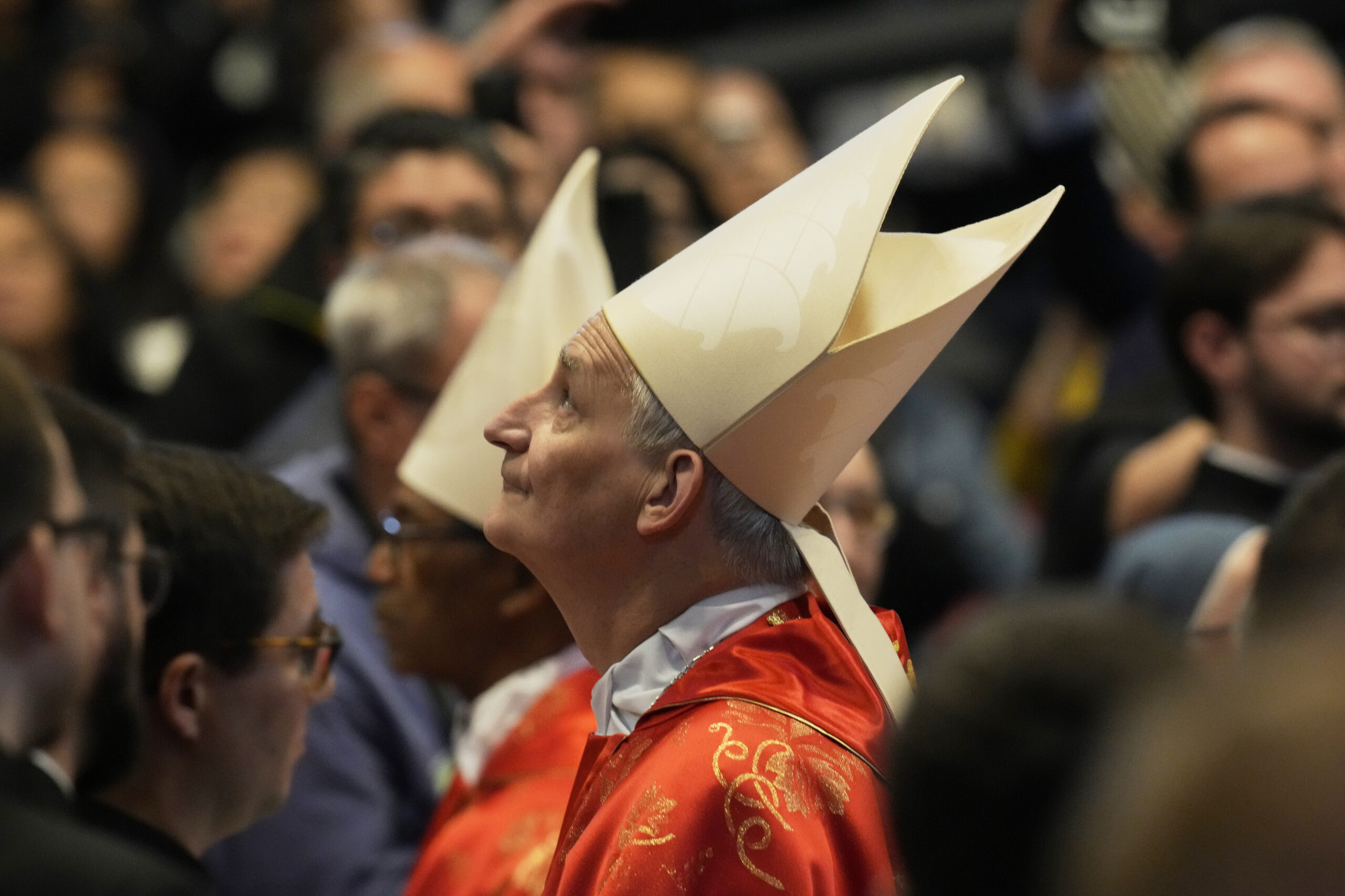 Cardinal Matteo Maria Zuppi looks up during a final Mass