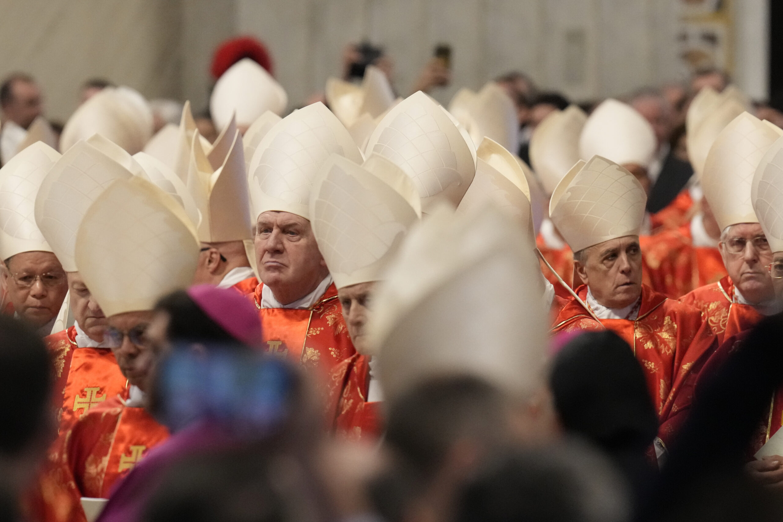 Cardinals attend a final Mass