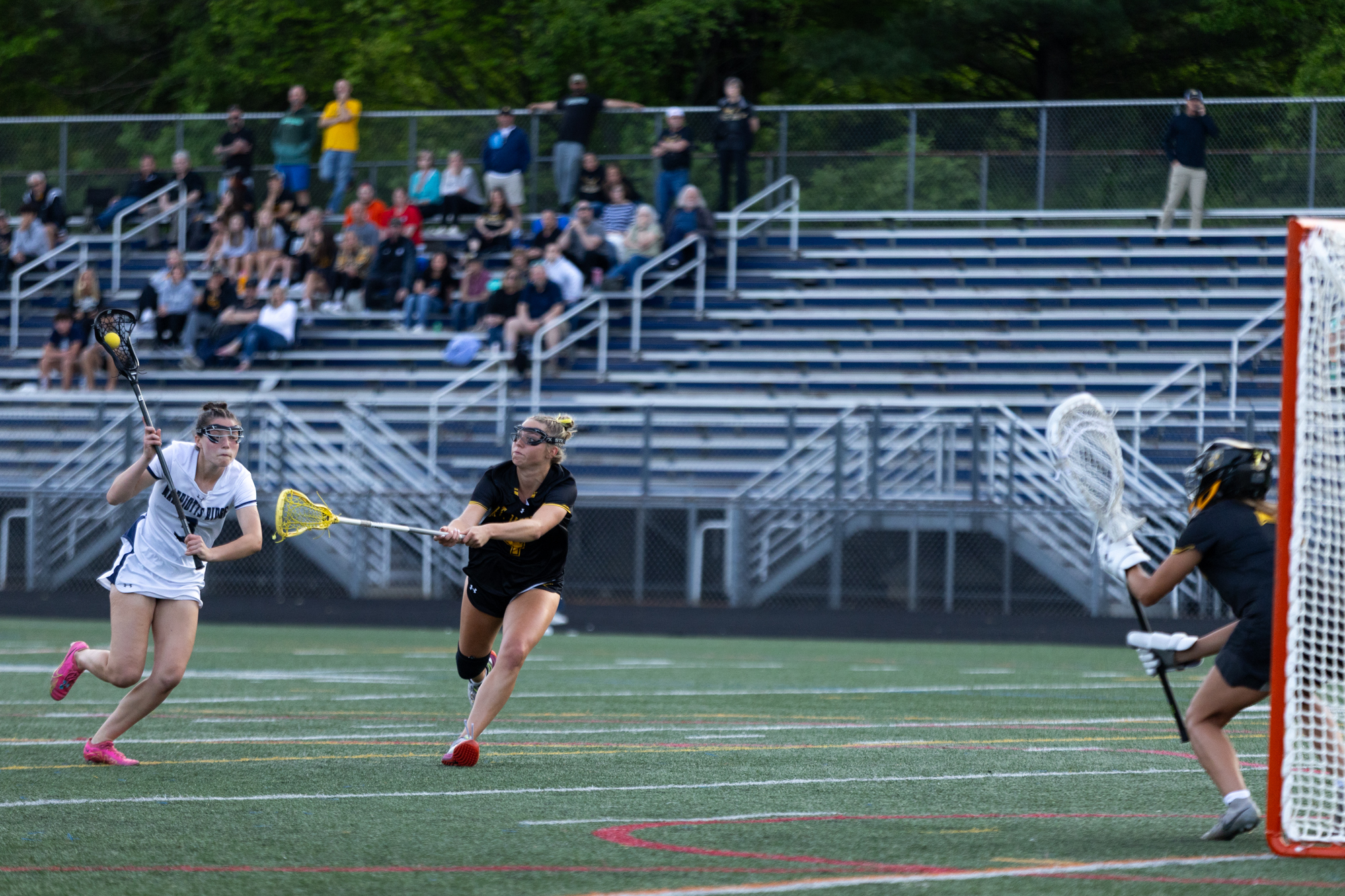 Marriotts Ridge’s Katie Leader charges in to take a free...