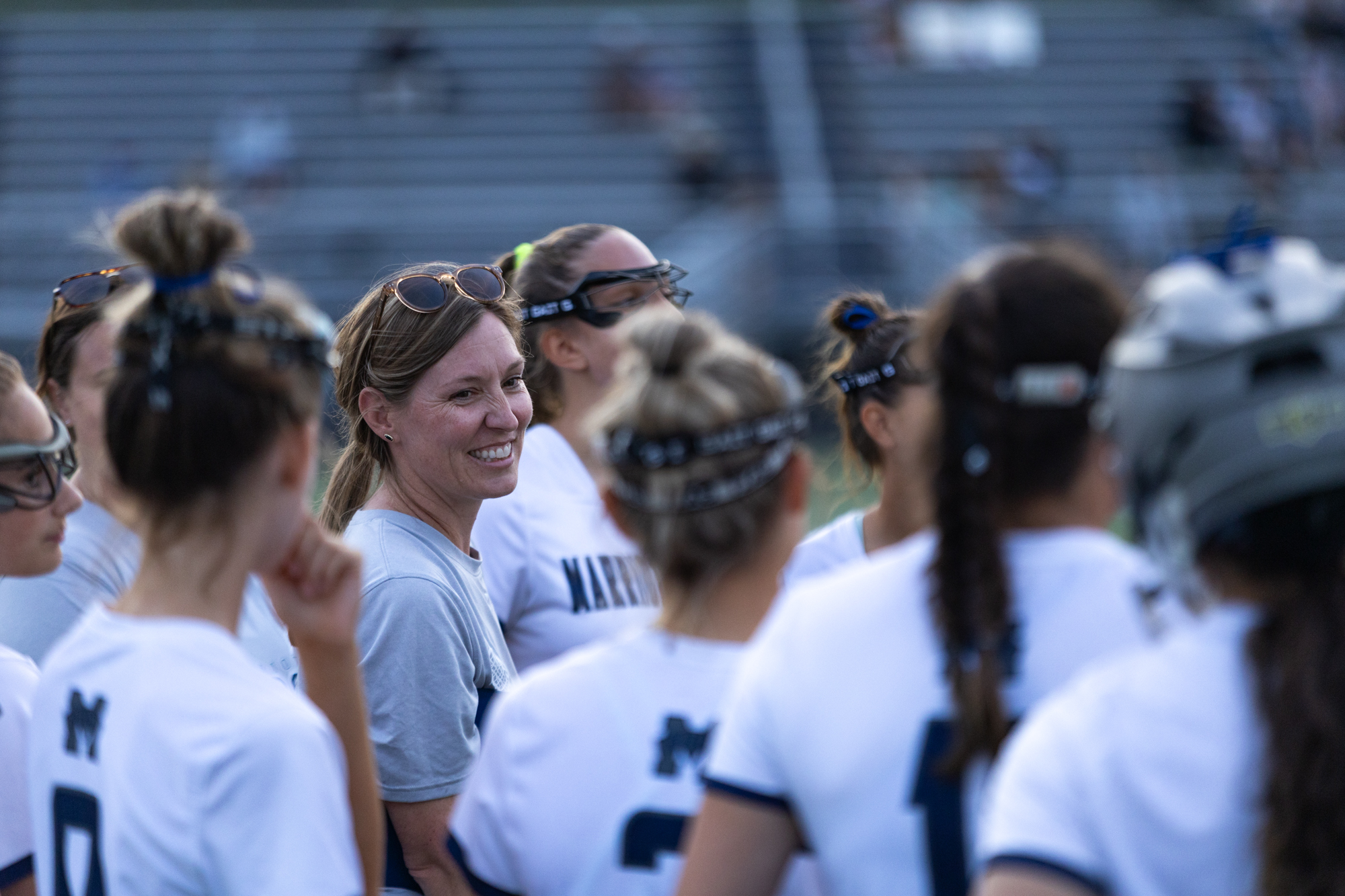 Marriotts Ridge coach Amanda Brady laughs with her team at...