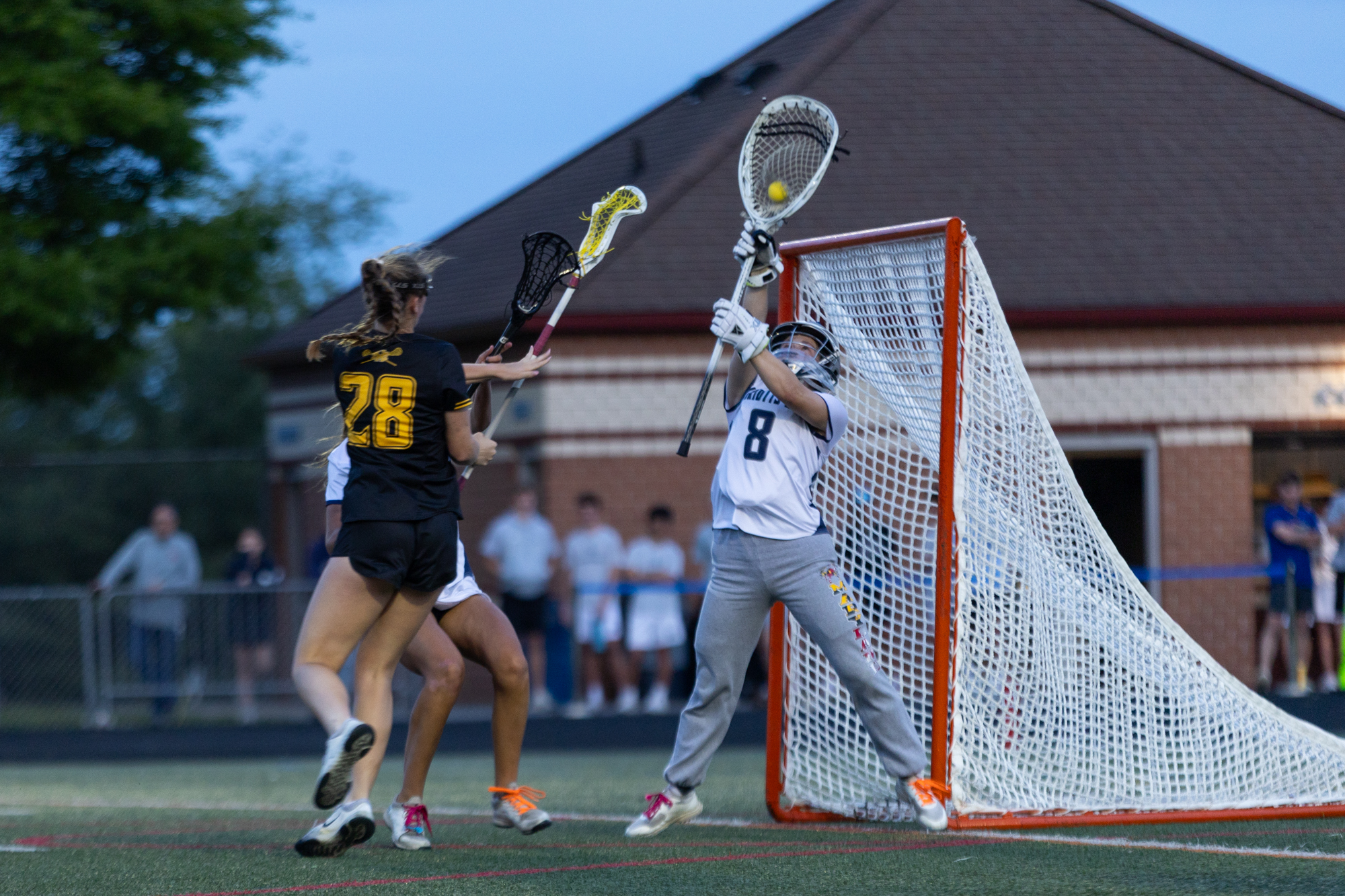Marriotts Ridge goaltender Kaelyn Krozy makes a save during the...