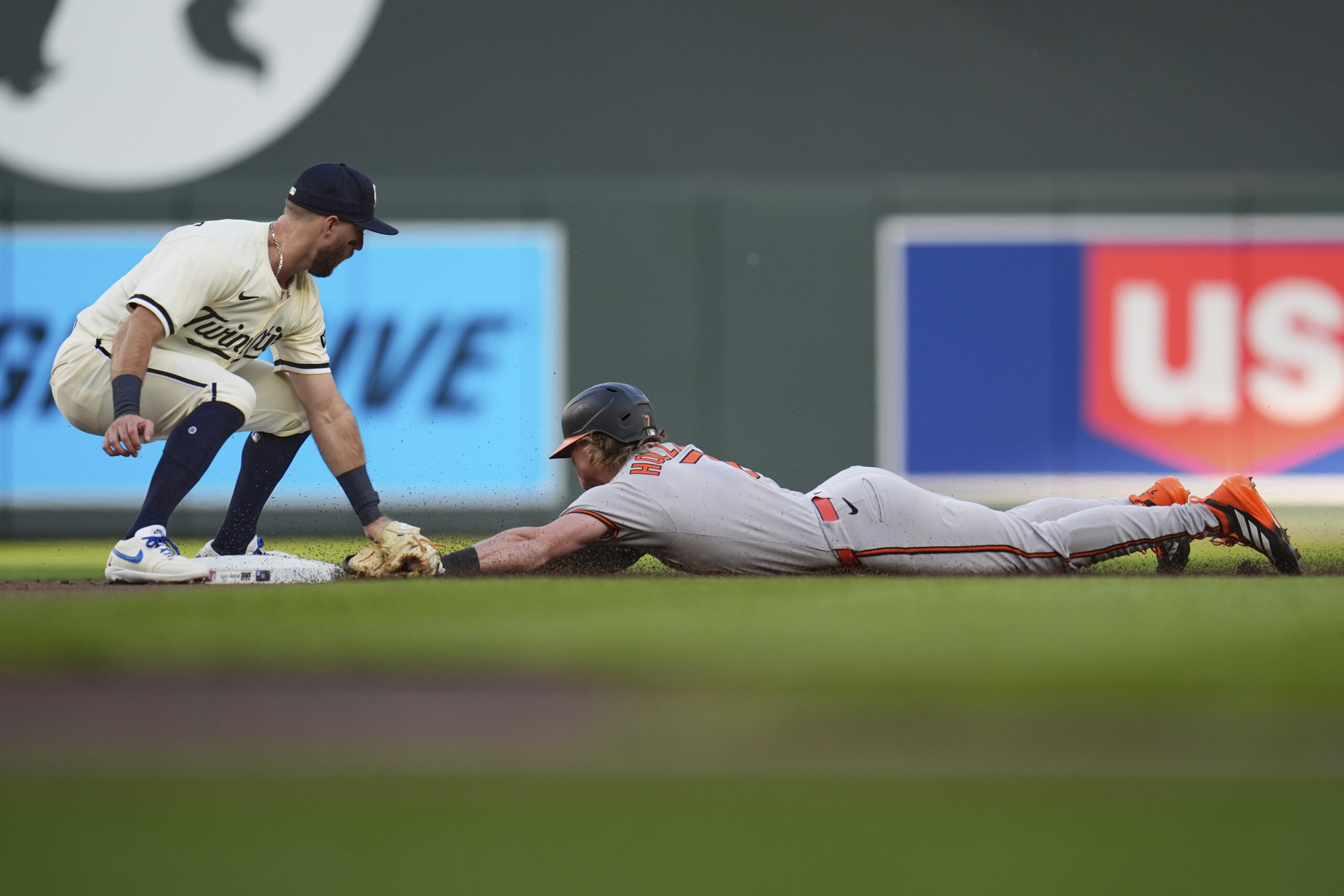 Baltimore Orioles' Jackson Holliday (7) is tagged out by Minnesota...