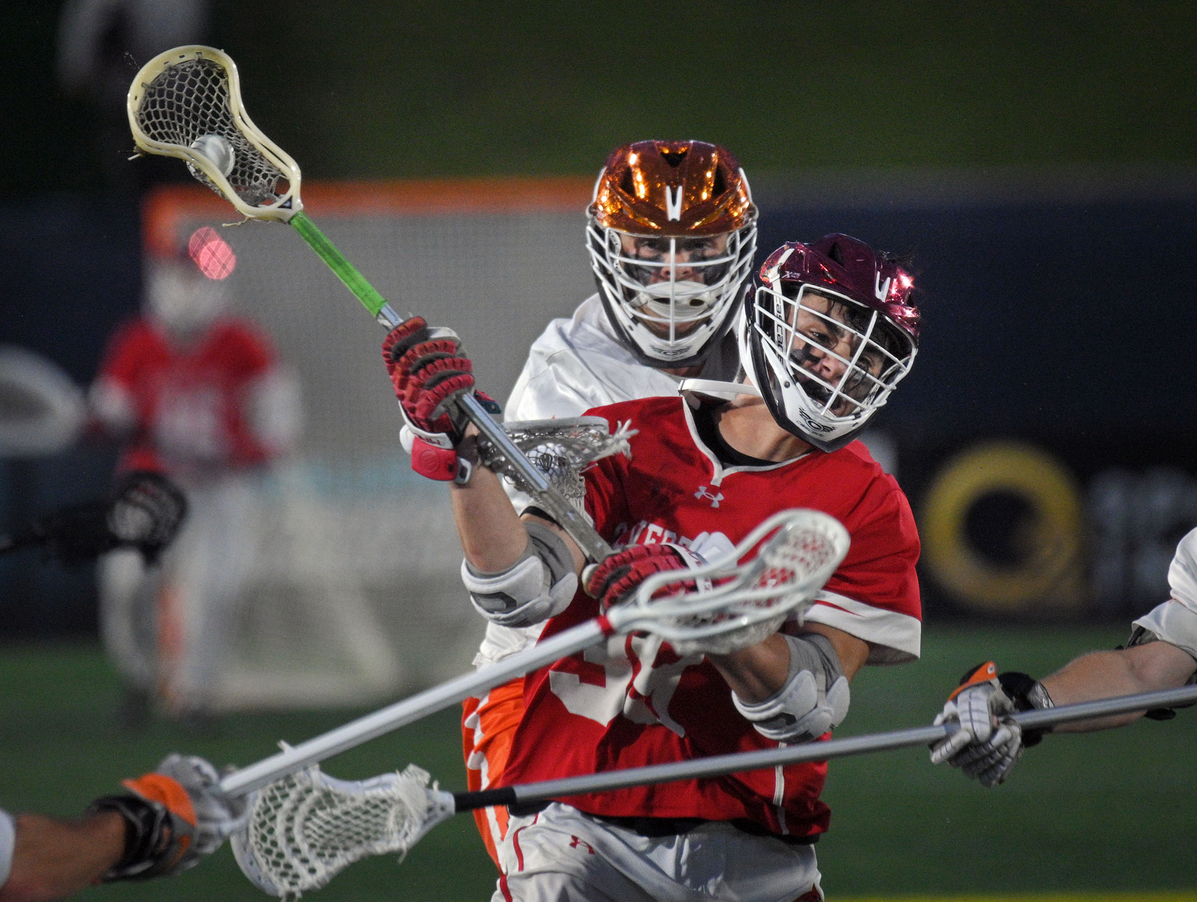 Calvert Hall’s Ben Cuomo scores after controlling a faceoff against...