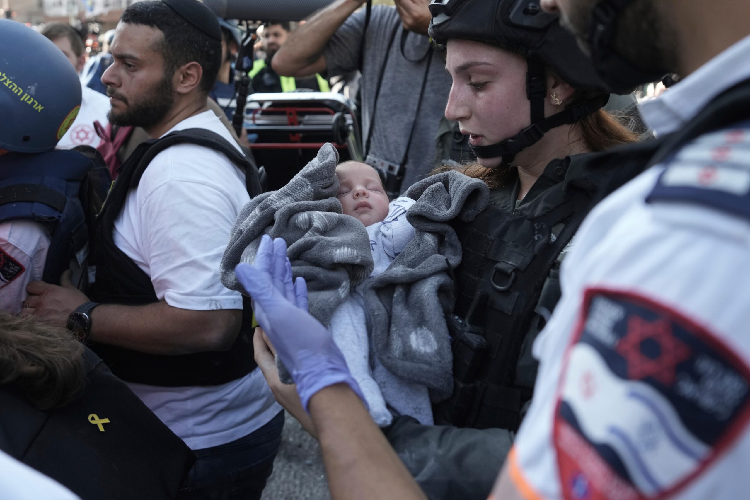 A baby is evacuated from the site of a direct...
