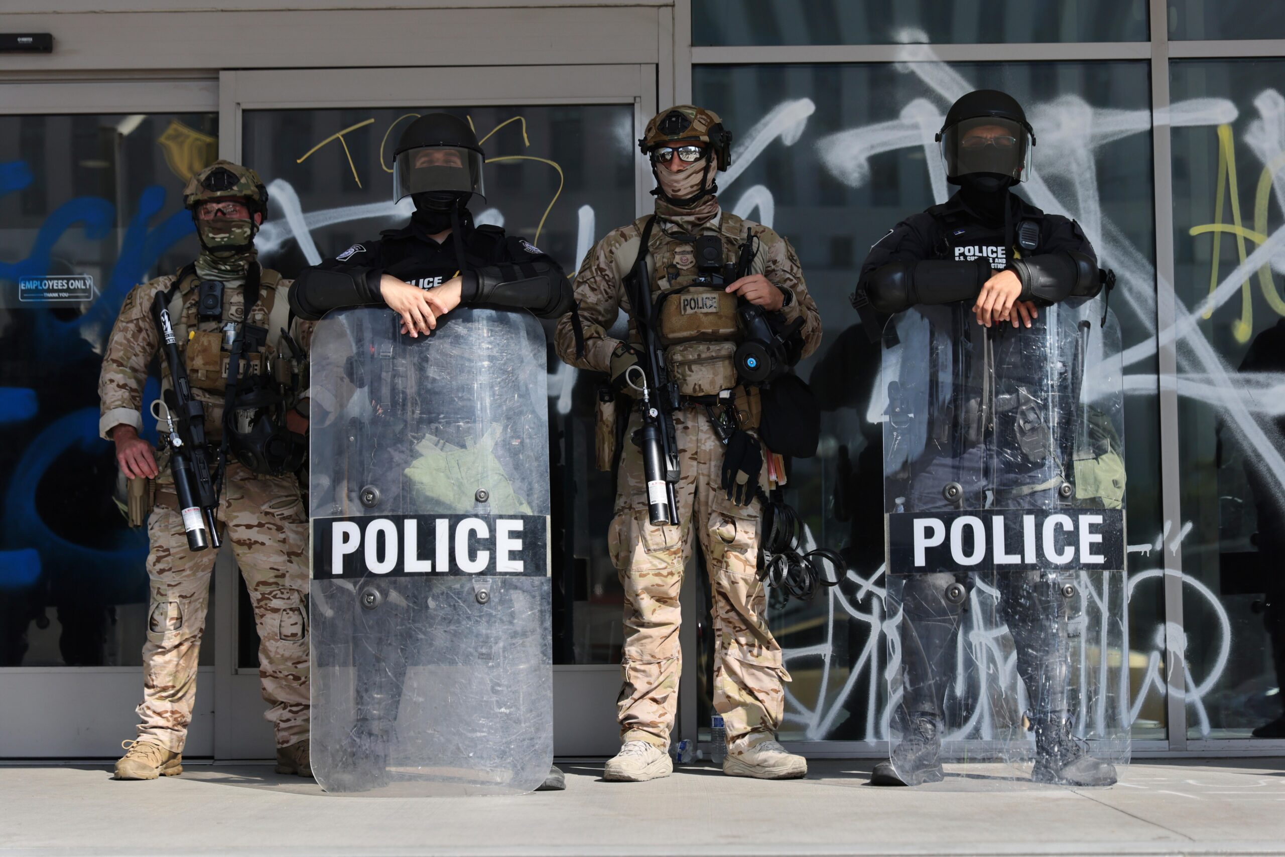 US Customs and Border Protection officers guard an entrance of...
