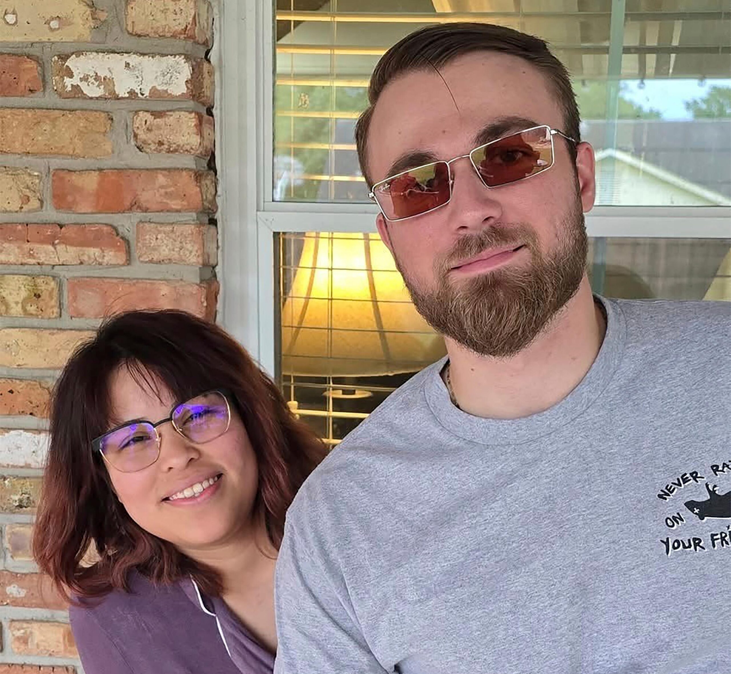 Adrian Clouatre takes a selfie of himself and his wife...