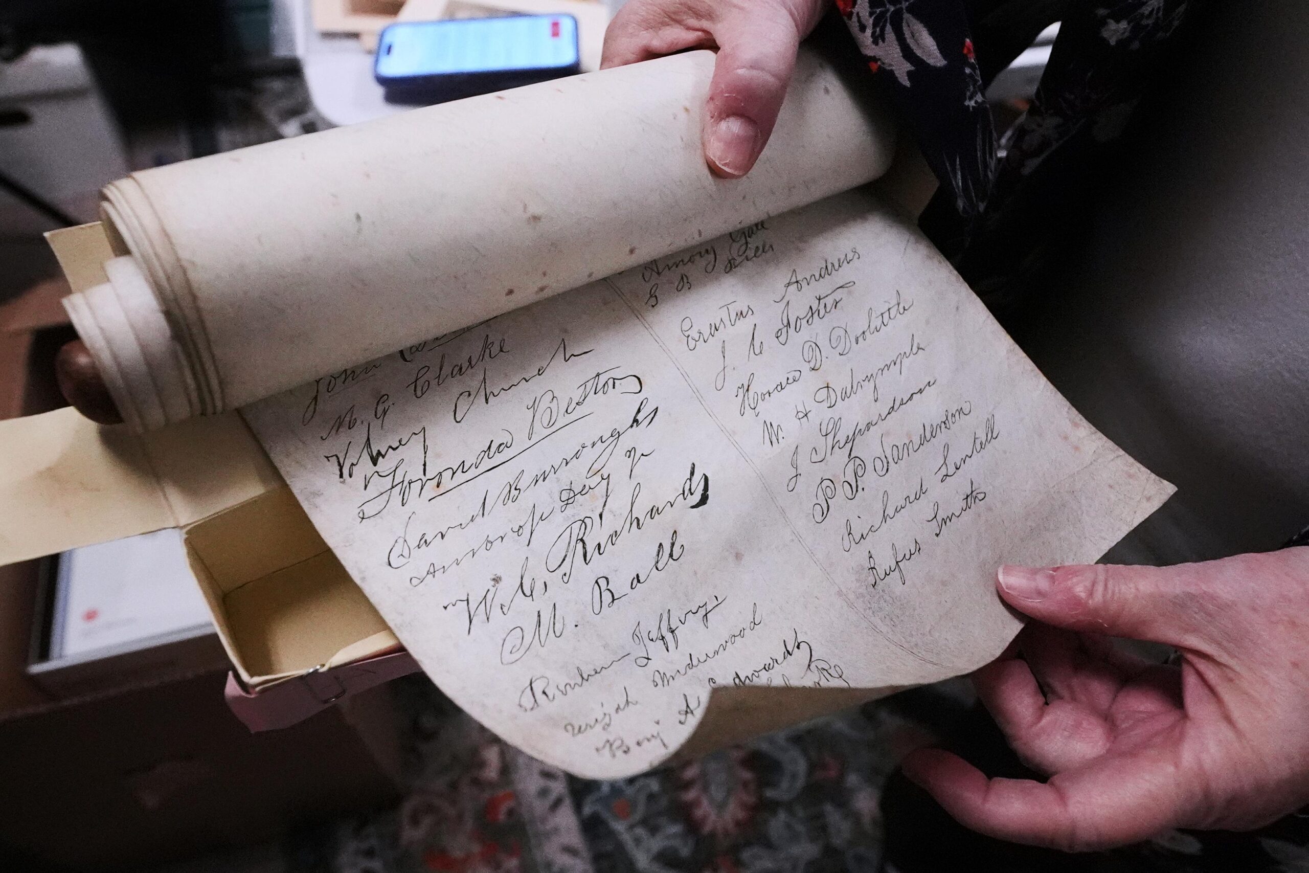 Rev. Diane Badger unfurls a recently found, 178-year-old anti-slavery scroll...