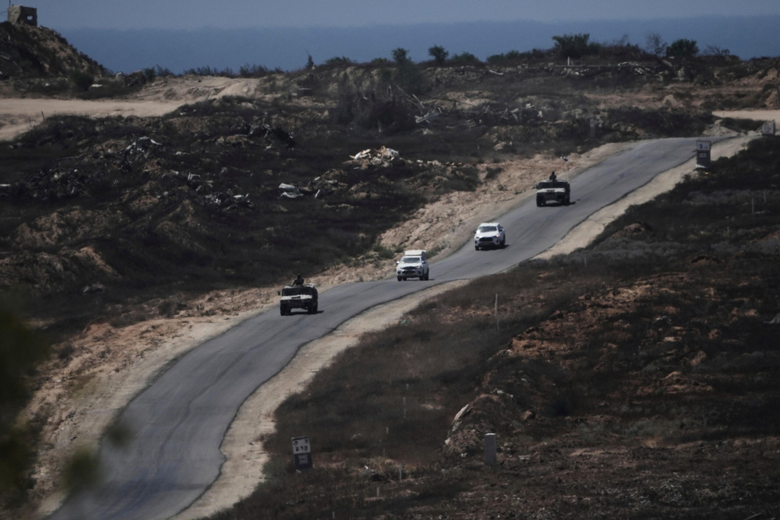 A convoy of Israel- military vehicles leaves the Gaza Strip...