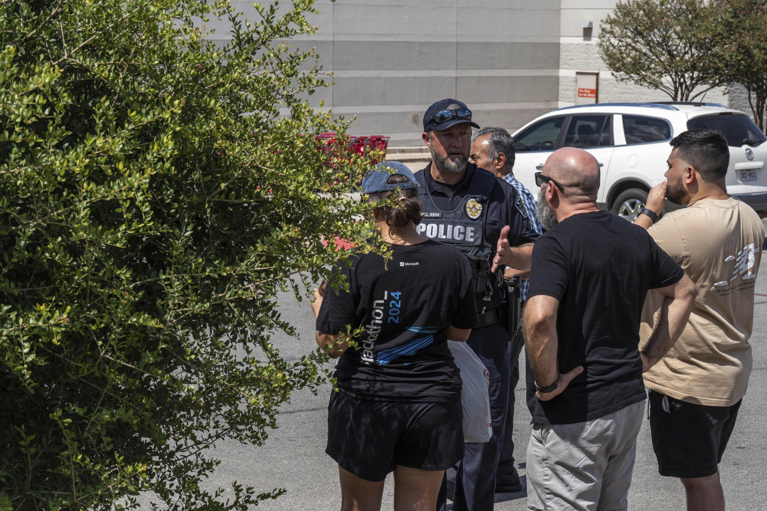 Law enforcement investigates a shooting at Target off Research Boulevard,...