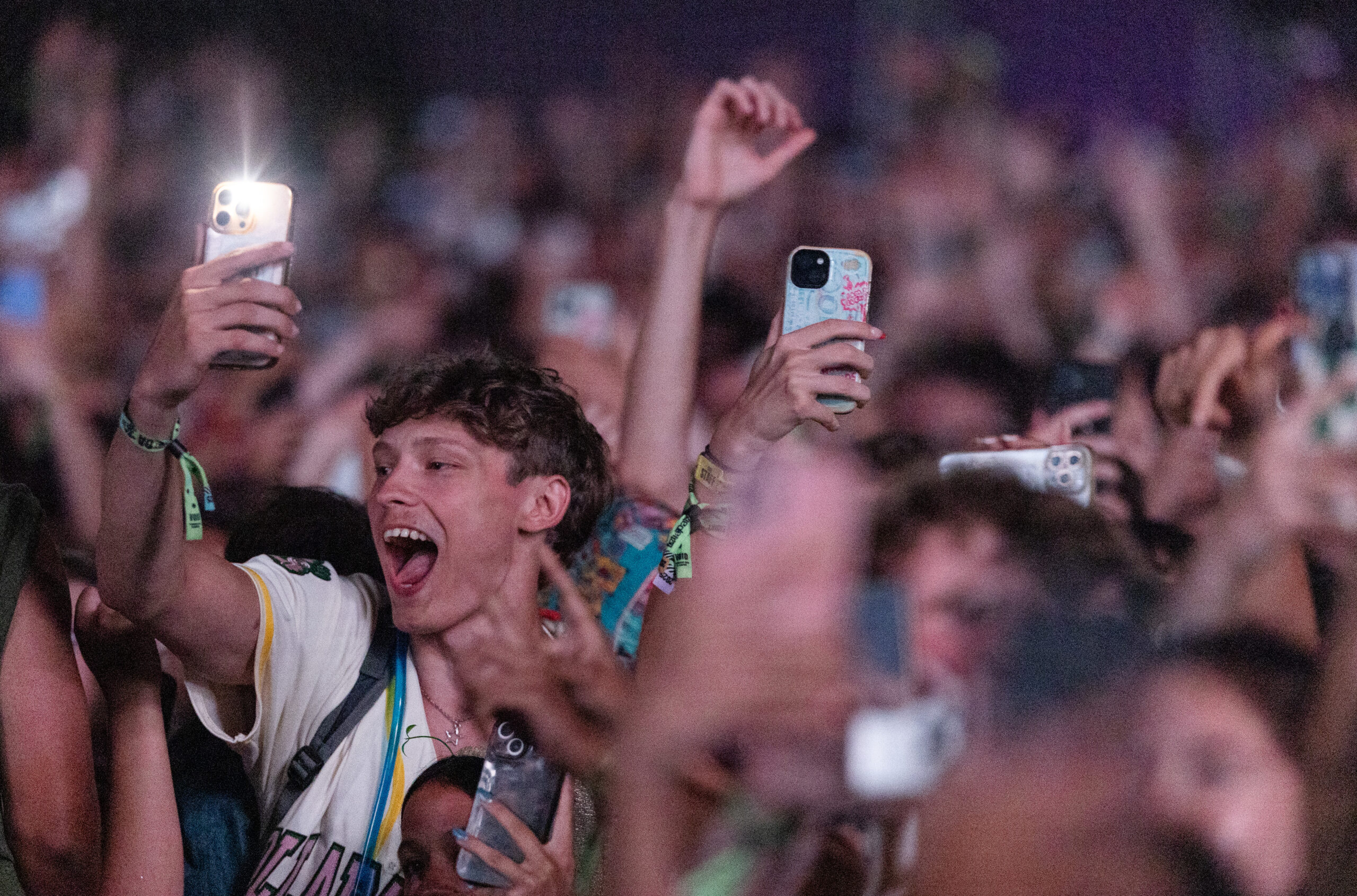 A crowd member sings along to A$AP Rocky’s performance at...