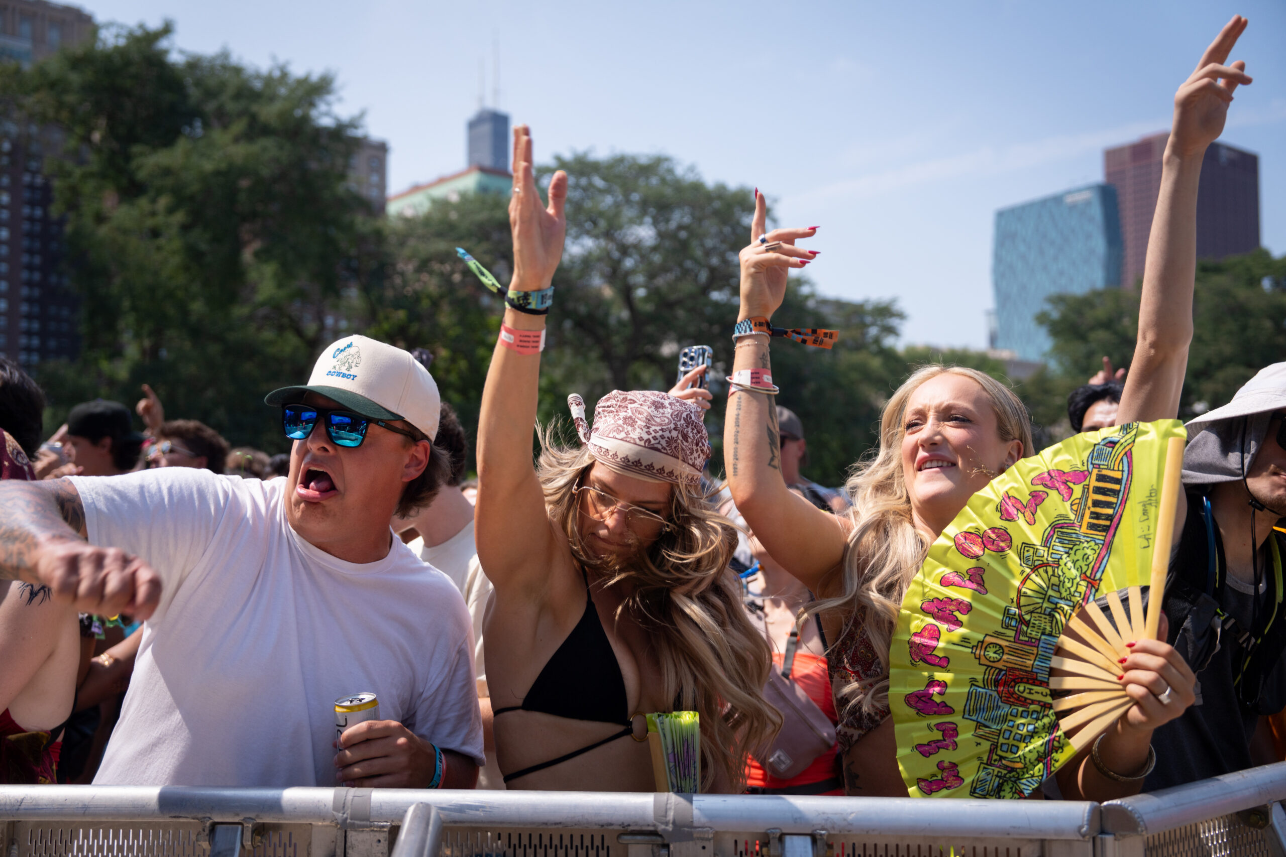 People dance to Layz during the third day of Lollapalooza...