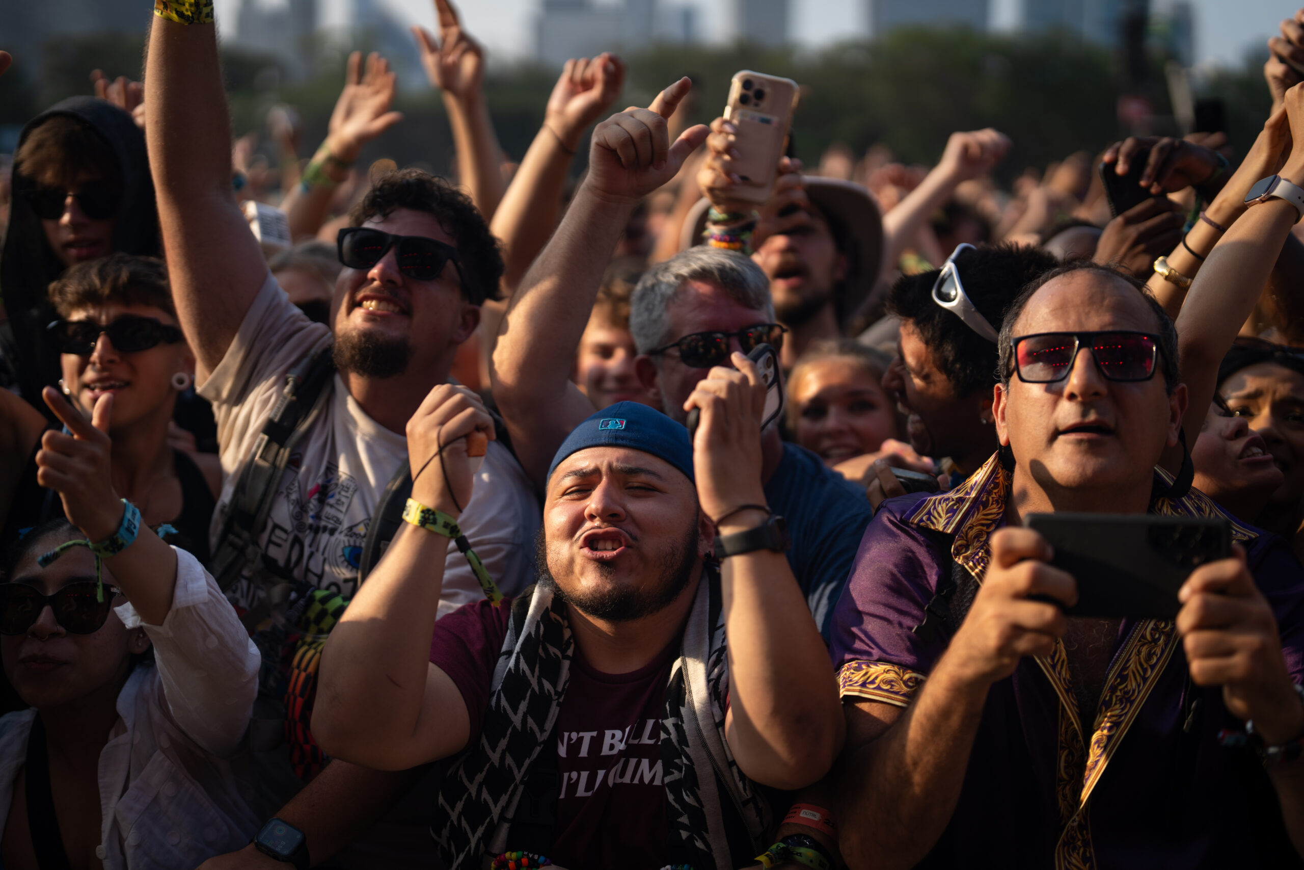 Arturo Trevino, center, dances as Chance the Rapper performs during...