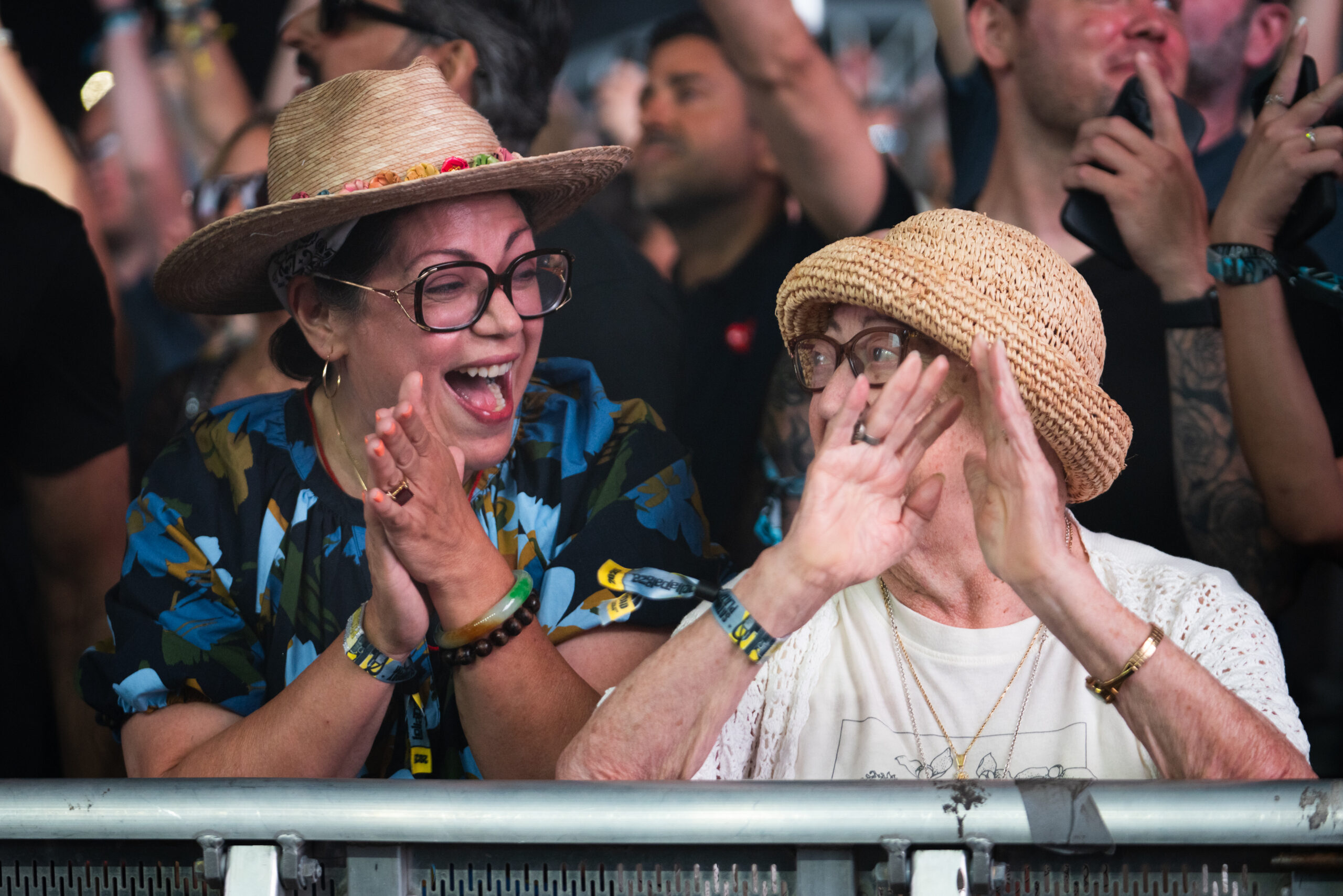 People dance as Rüfüs Du Sol performs on the third...