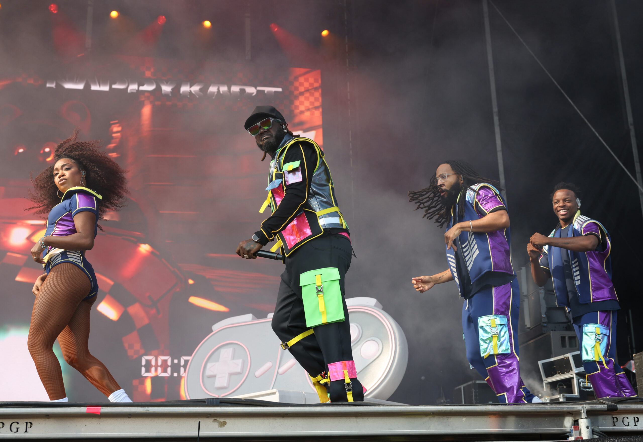 T-Pain, center, performs at Lollapalooza, Aug. 1, 2025, in Chicago....