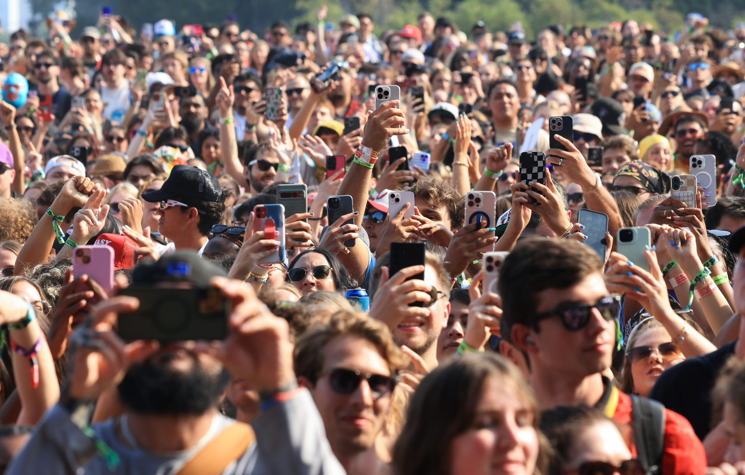 Festival attendees watch T-Pain perform at Lollapalooza, Aug. 1, 2025,...