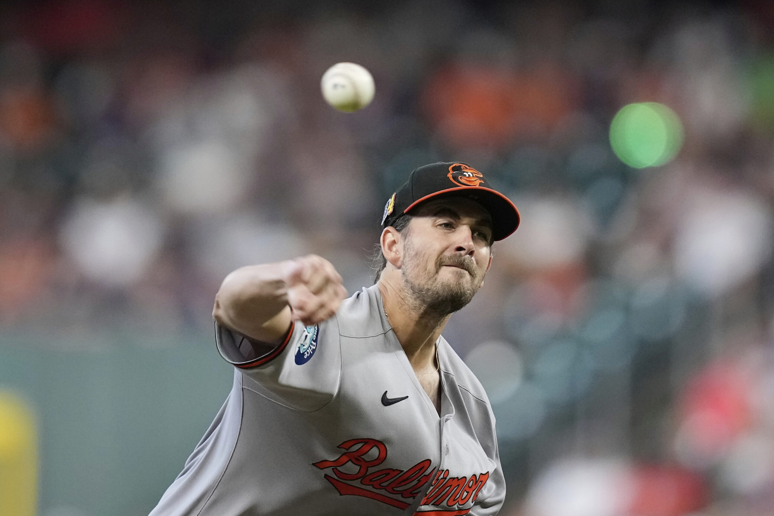 Baltimore Orioles starting pitcher Dean Kremer throws against the Houston...