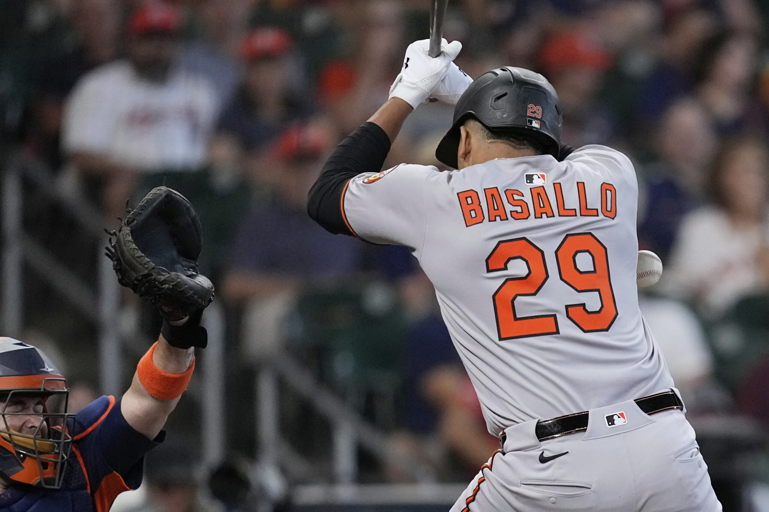 Baltimore Orioles' Samuel Basallo is hit by a pitch thrown...