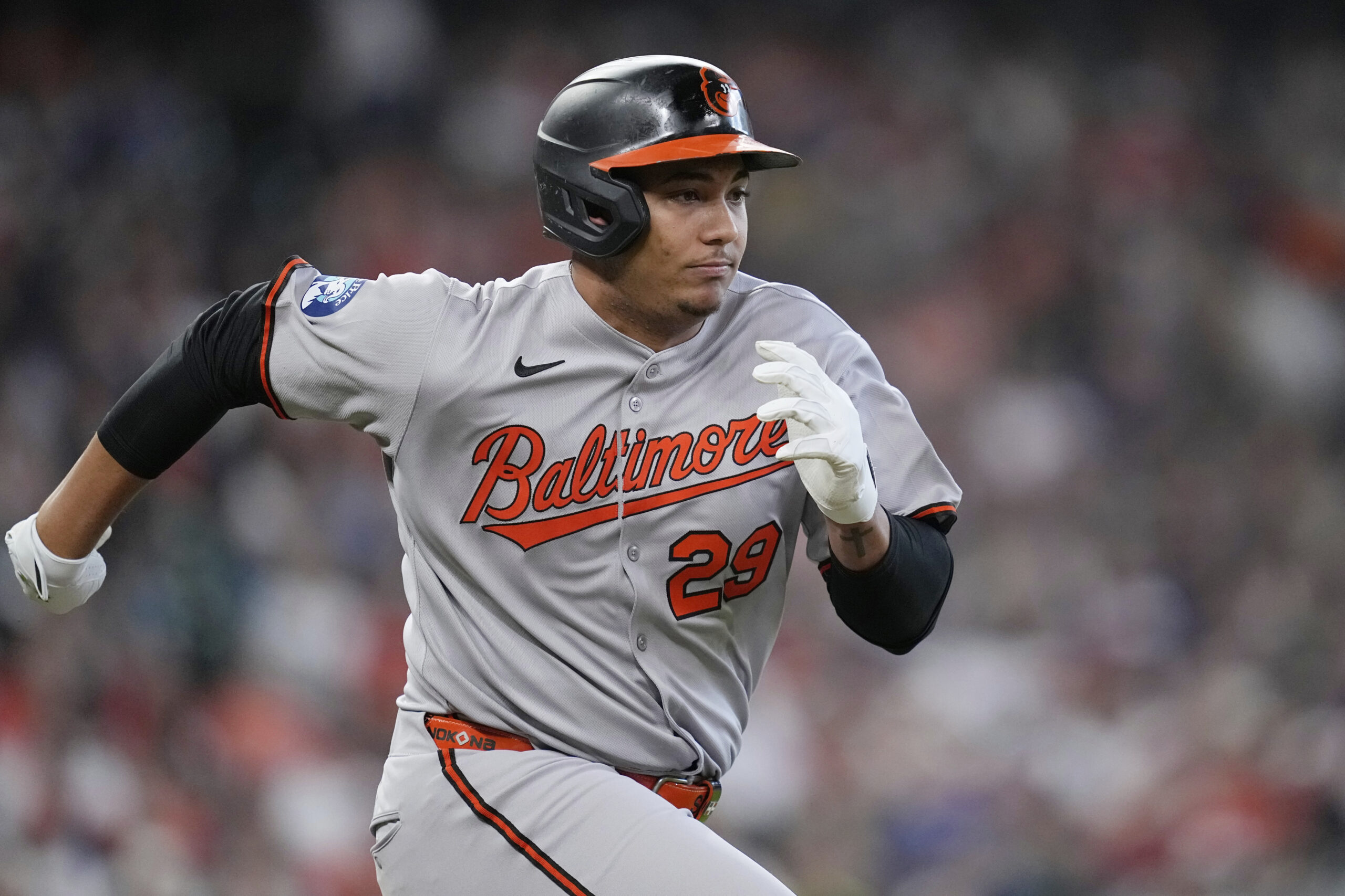 Baltimore Orioles' Samuel Basallo runs up the first base line...