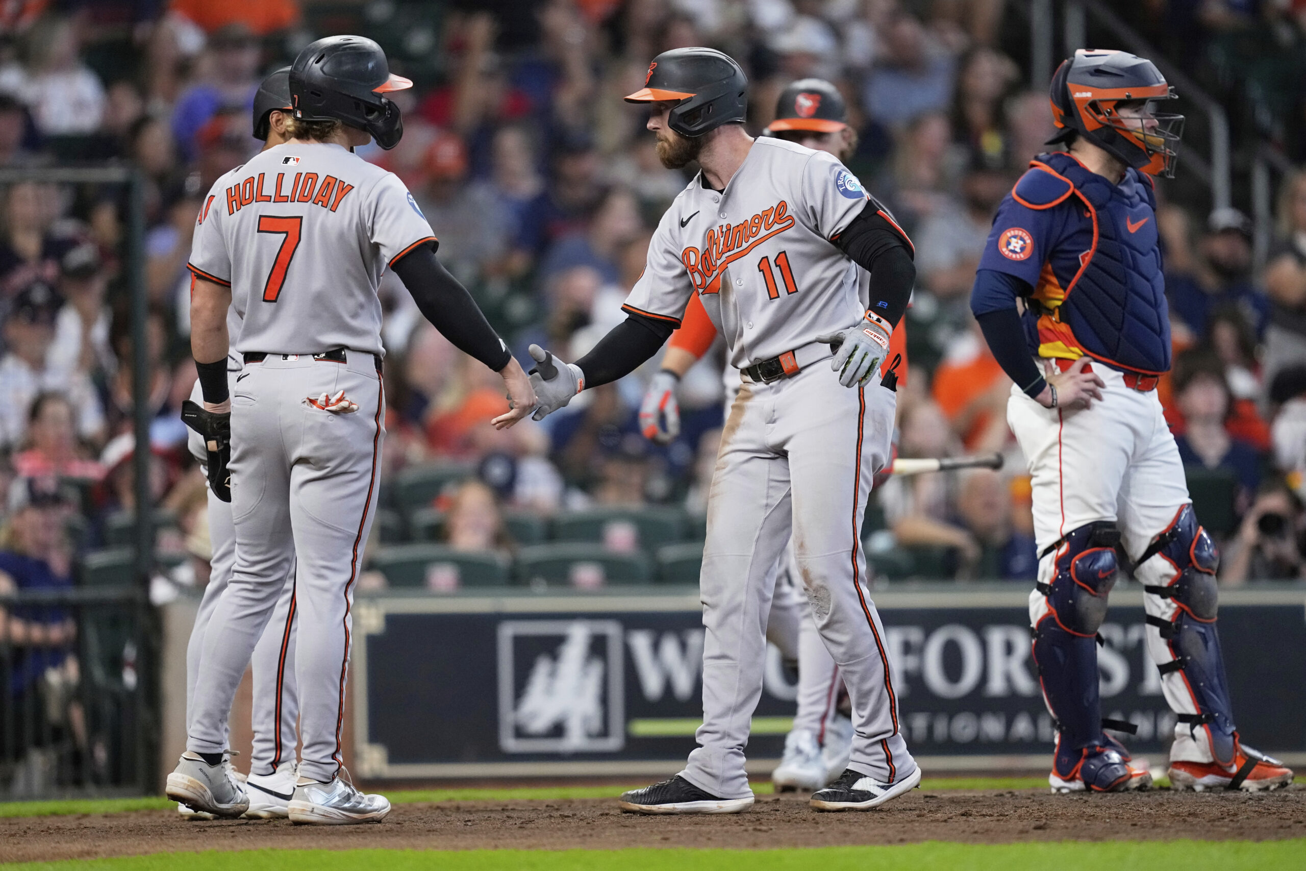 Baltimore Orioles' Jordan Westburg (11) celebrates with Jackson Holliday (7)...