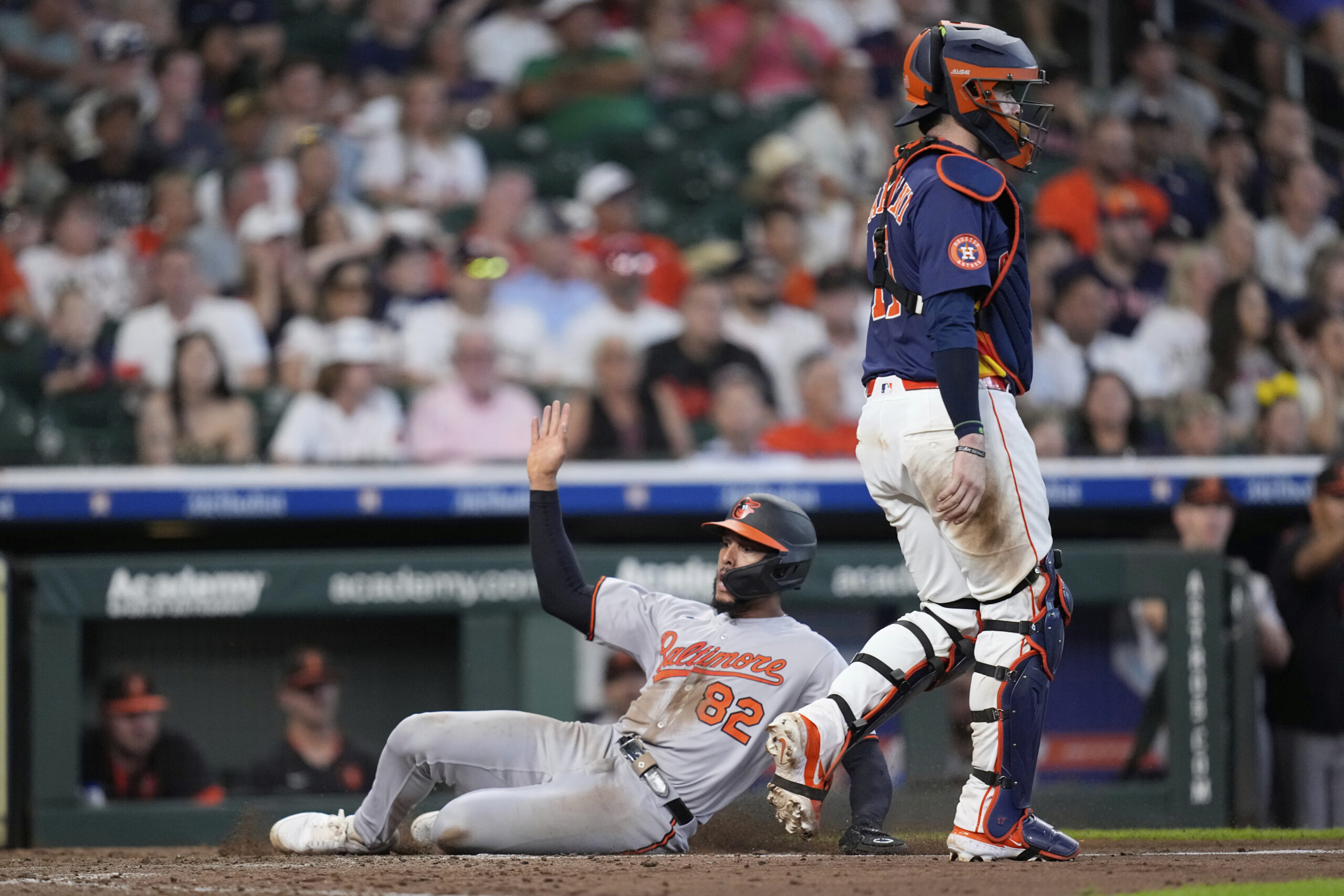 Baltimore Orioles' Jeremiah Jackson (82) scores as Houston Astros catcher...