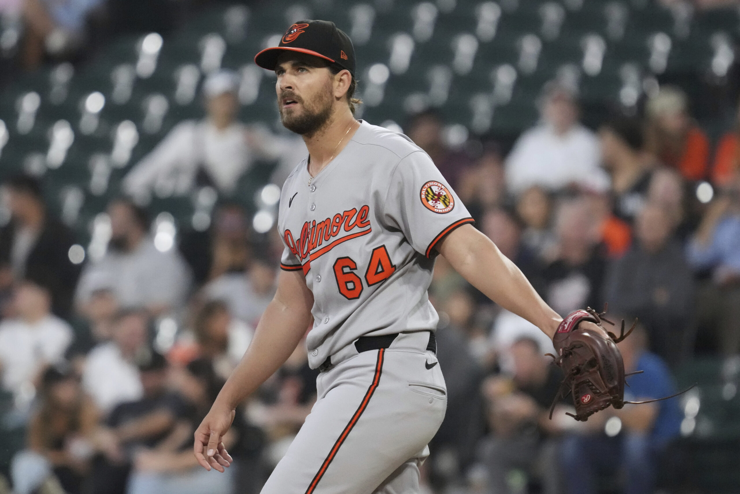 Baltimore Orioles starting pitcher Dean Kremer reacts after Chicago White...