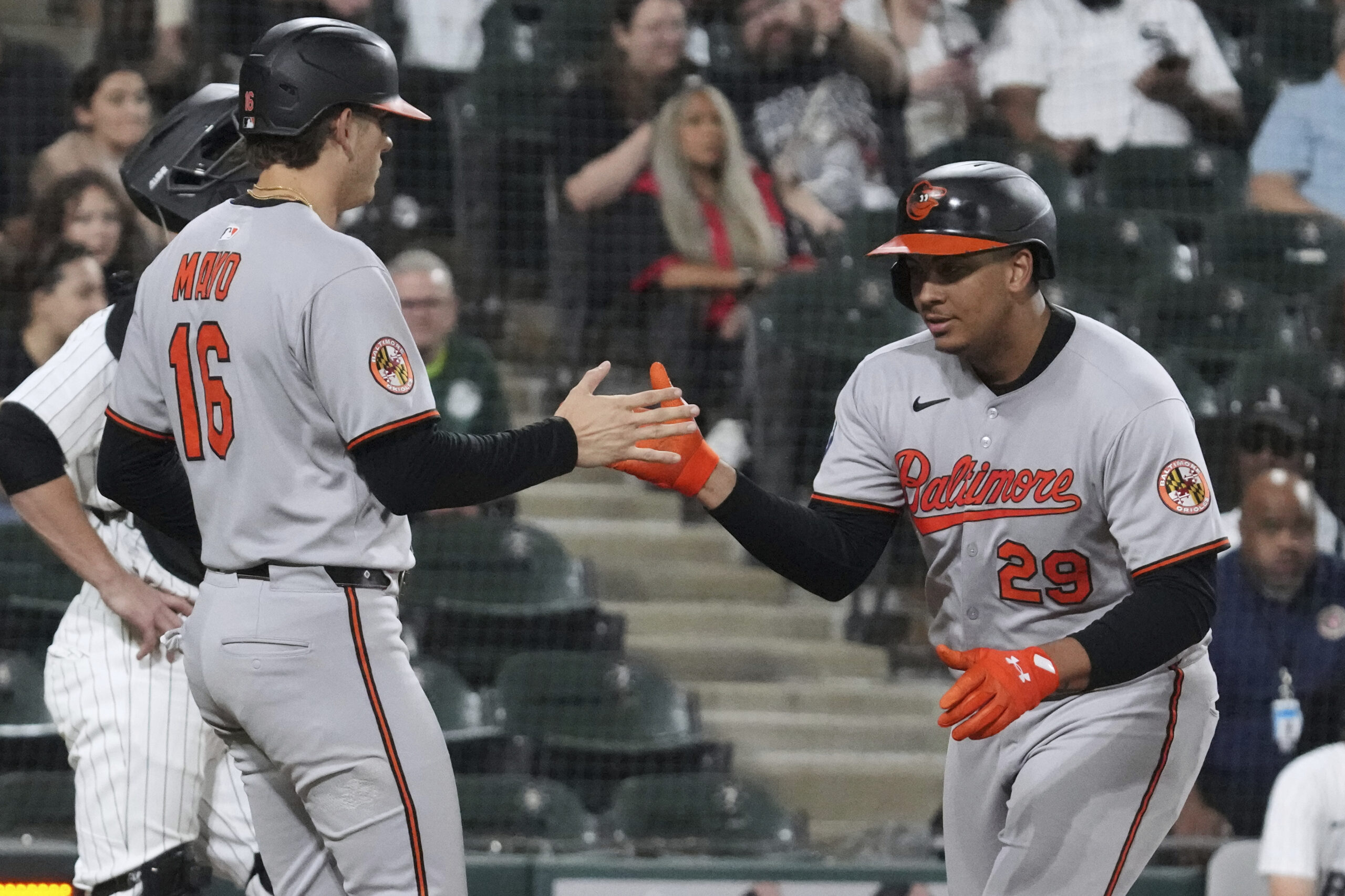 Baltimore Orioles' Samuel Basallo, right, celebrates with Coby Mayo after...