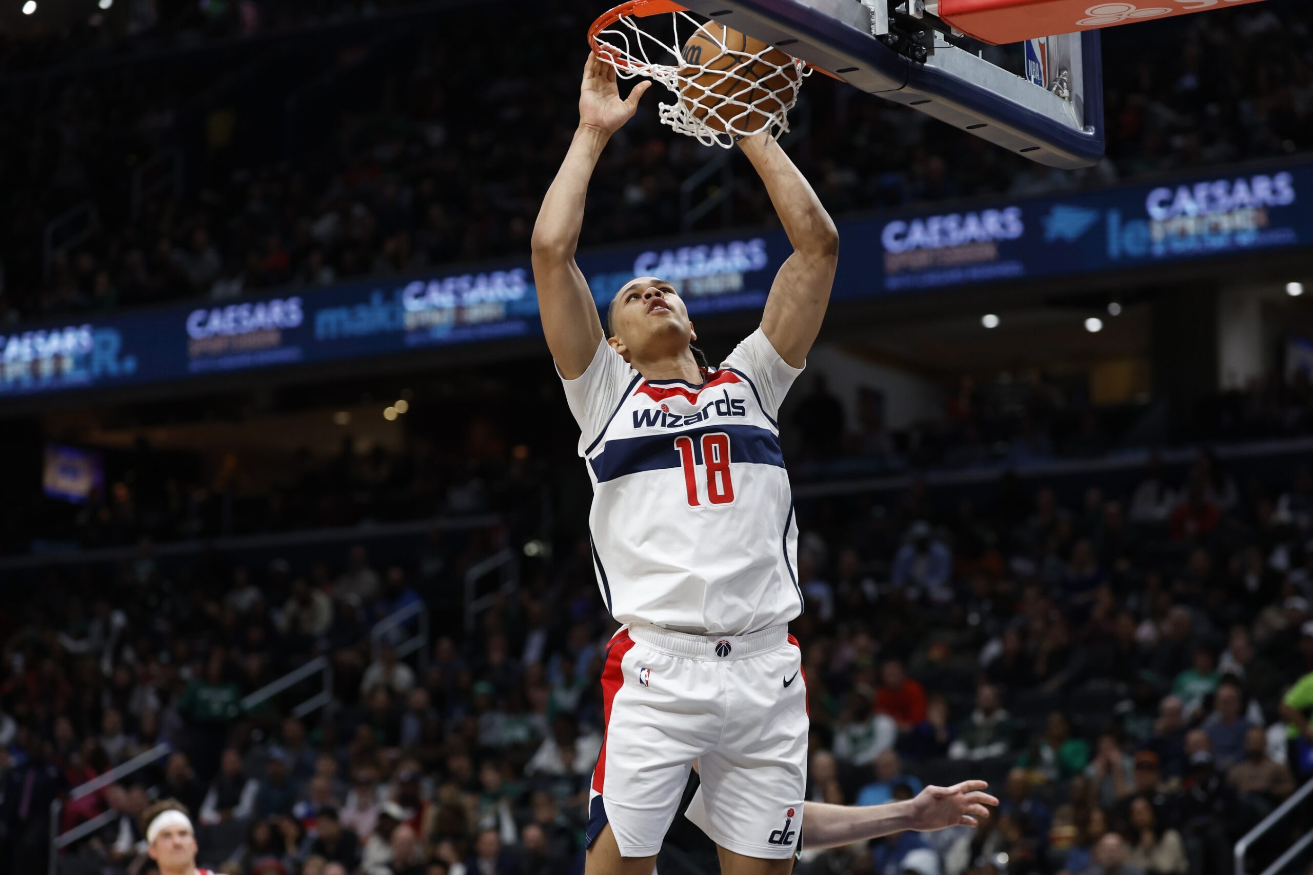 Washington Wizards forward Kyshawn George (18) dunks th ball against the Boston Celtics in the second half at Capital One Arena.