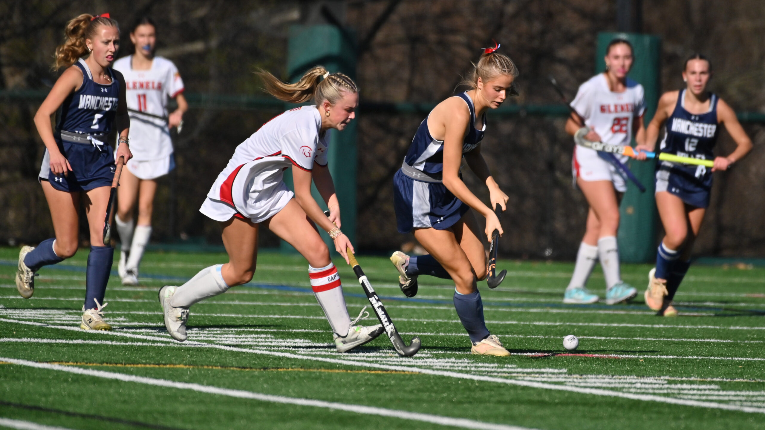 Glenelg's Lexi WInters, left, and Manchester Valley's Ellsy Zour contend...