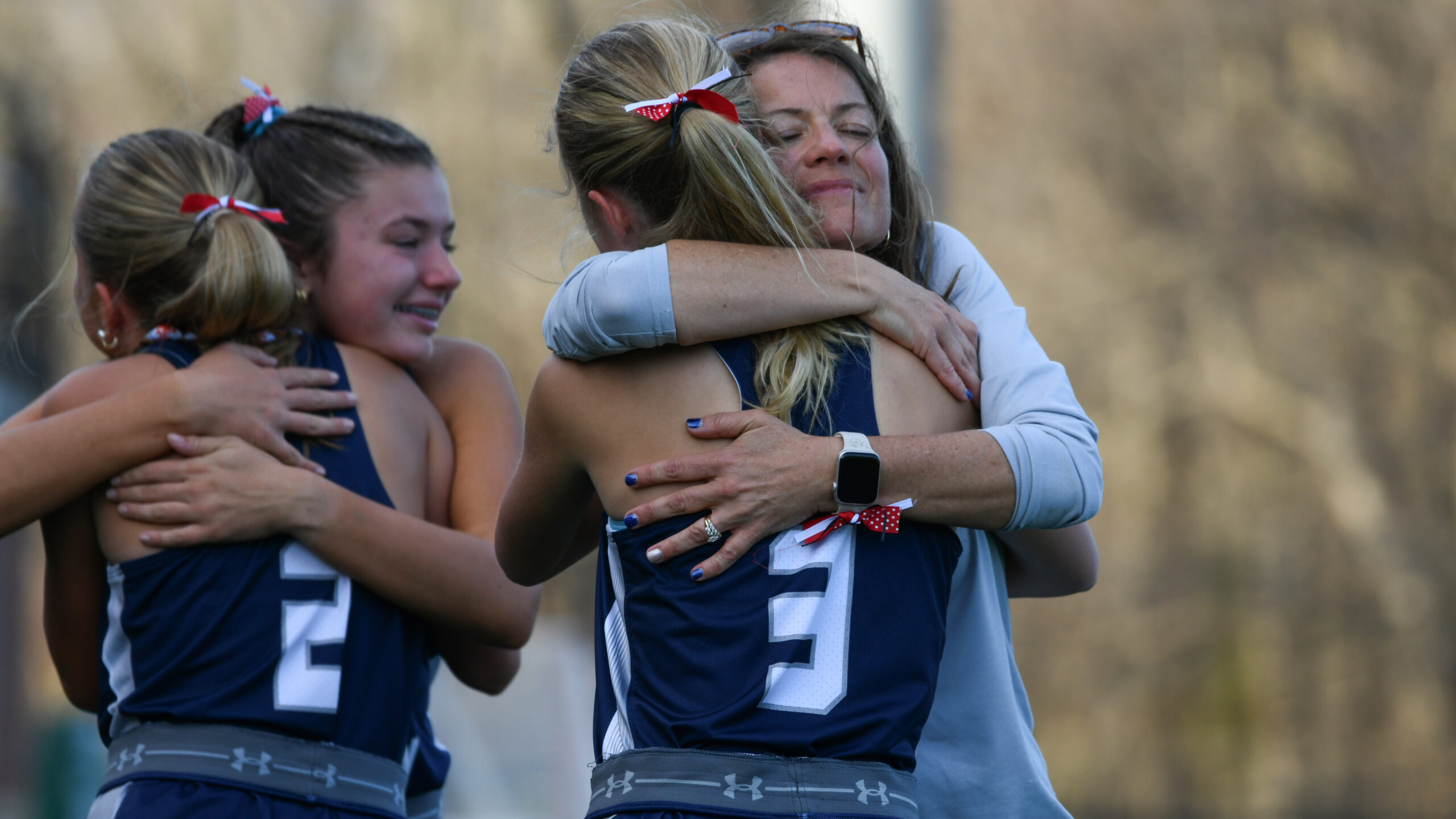 Manchester Valley players and coaches embrace following their loss to...