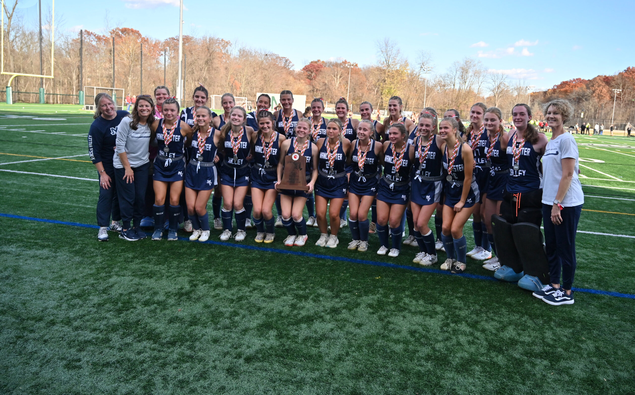 Manchester Valley pose with their finalist trophy following their loss...