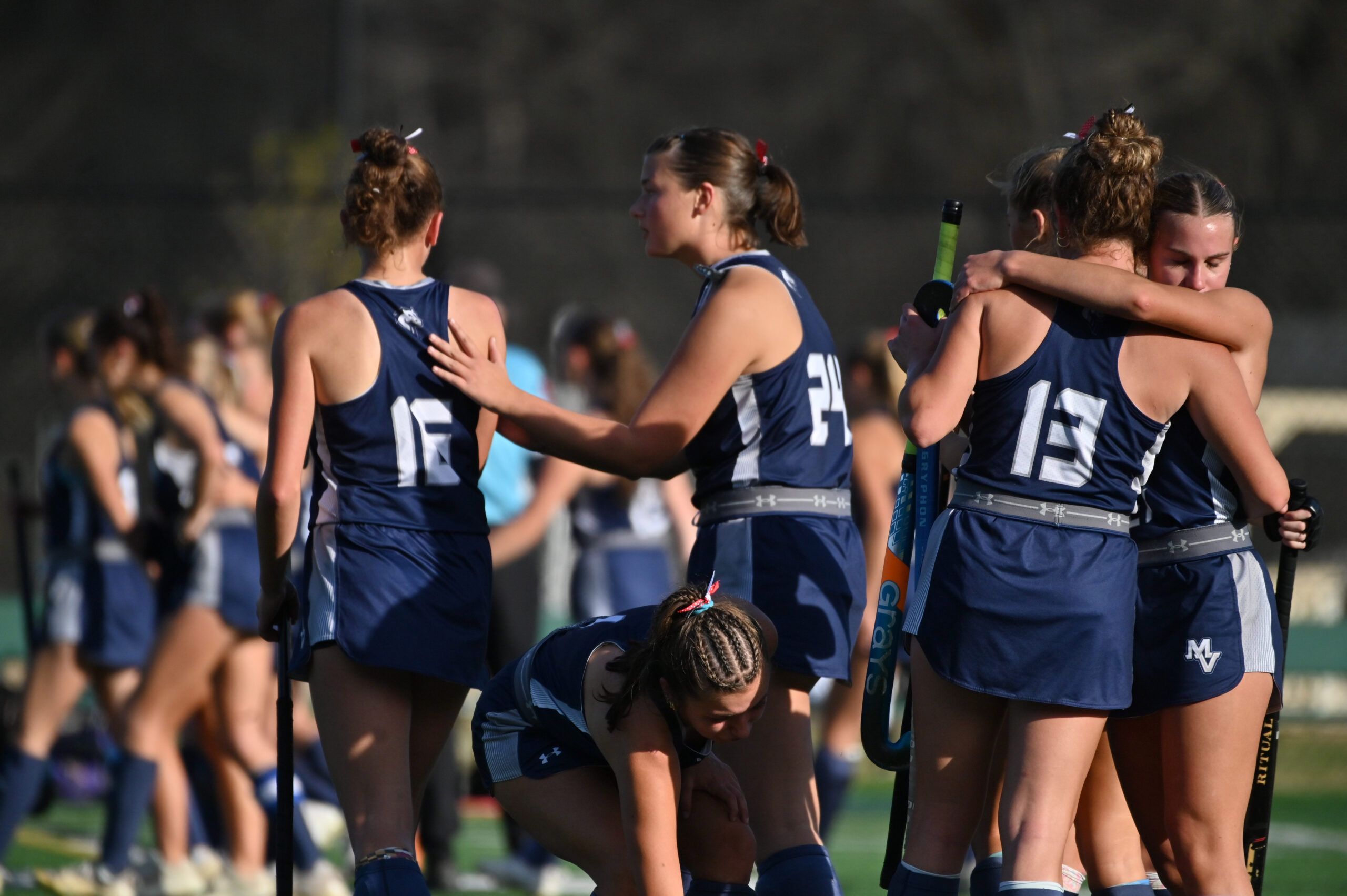 Manchester Valley players console each other following their loss to...