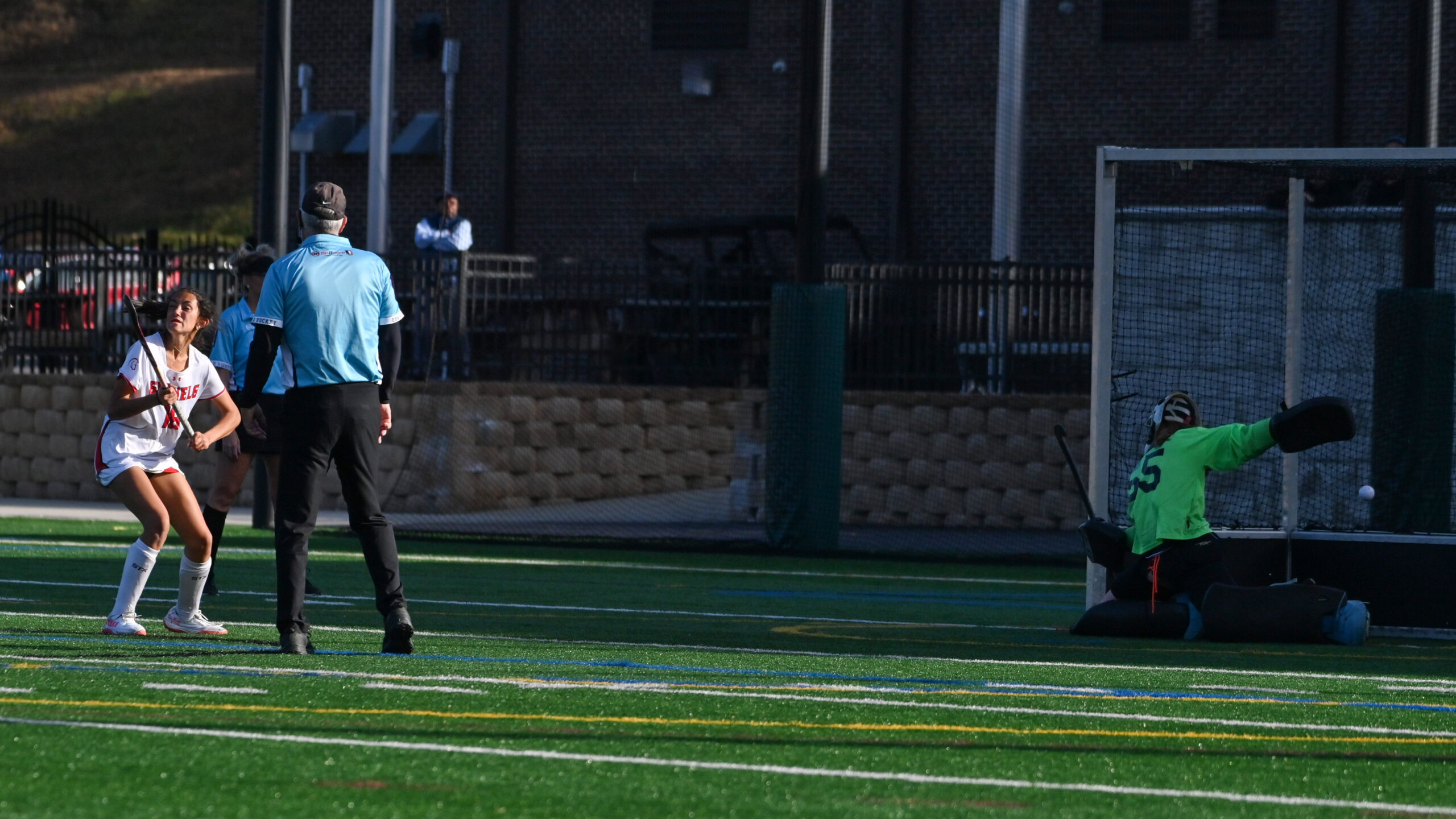Glenelg's Lakshmi Almli, left, puts a penalty shot past Manchester...