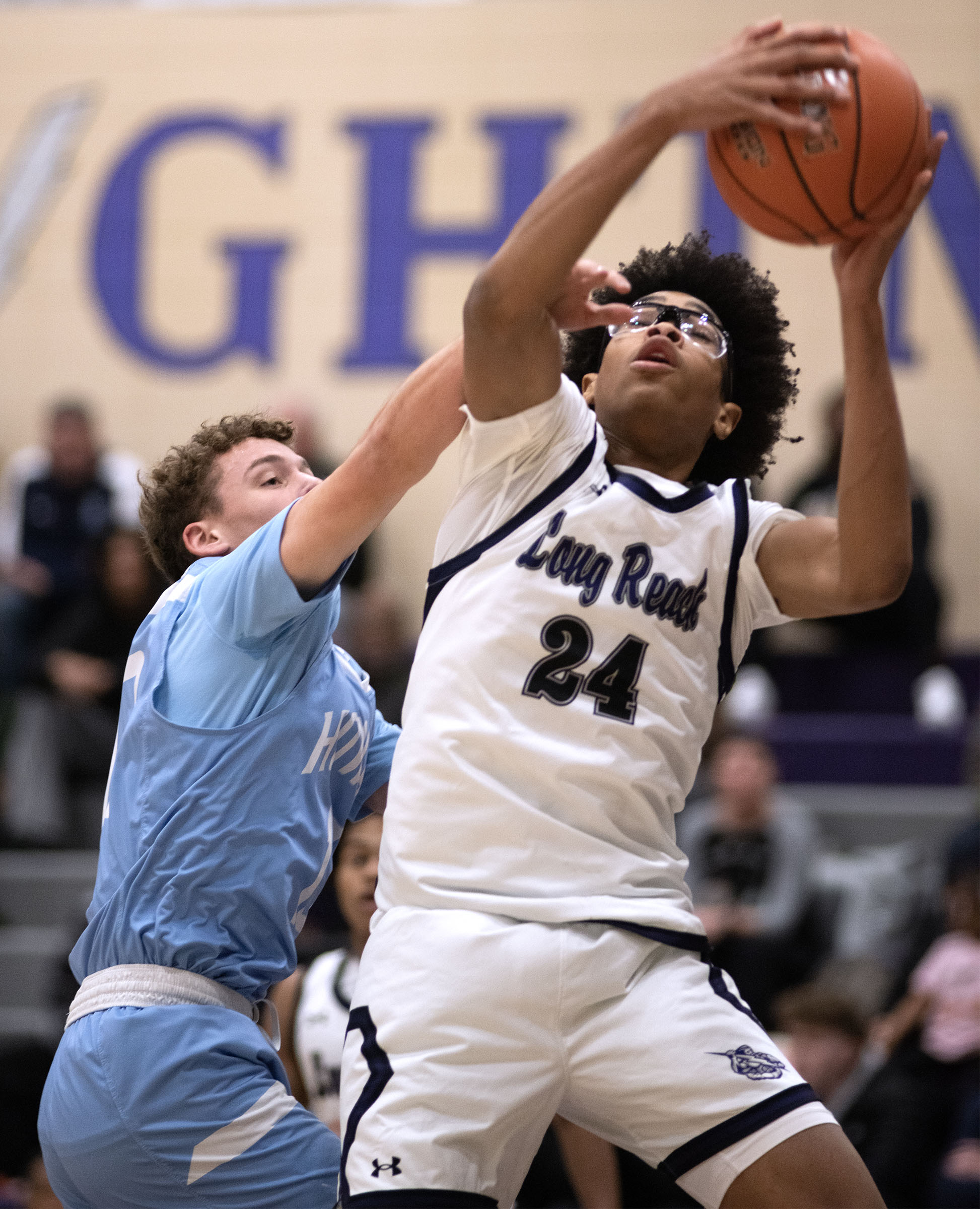 Dec. 22, 2025- Long Reach's Josh Hurd grabs a rebound...