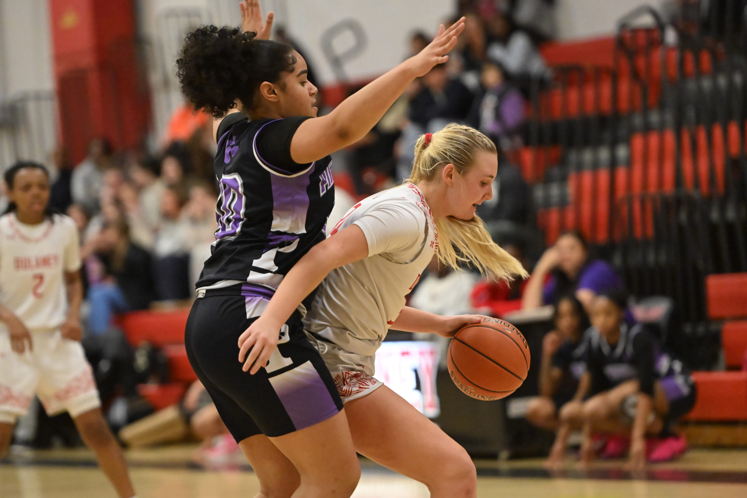Dulaney's Torunn Spencer tries to get around Pikesville defender Alaina...