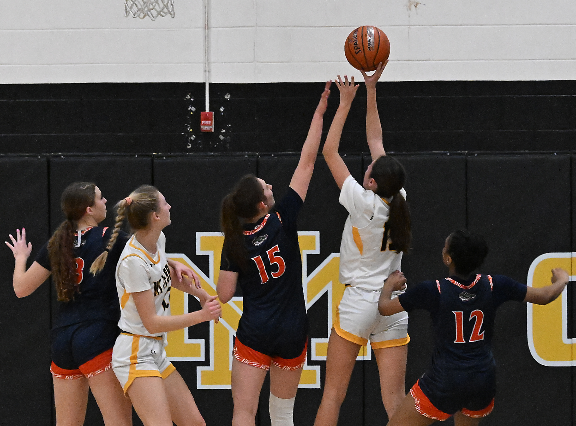 Hebron #15, Sophie Mitchell scores two in the paint in...