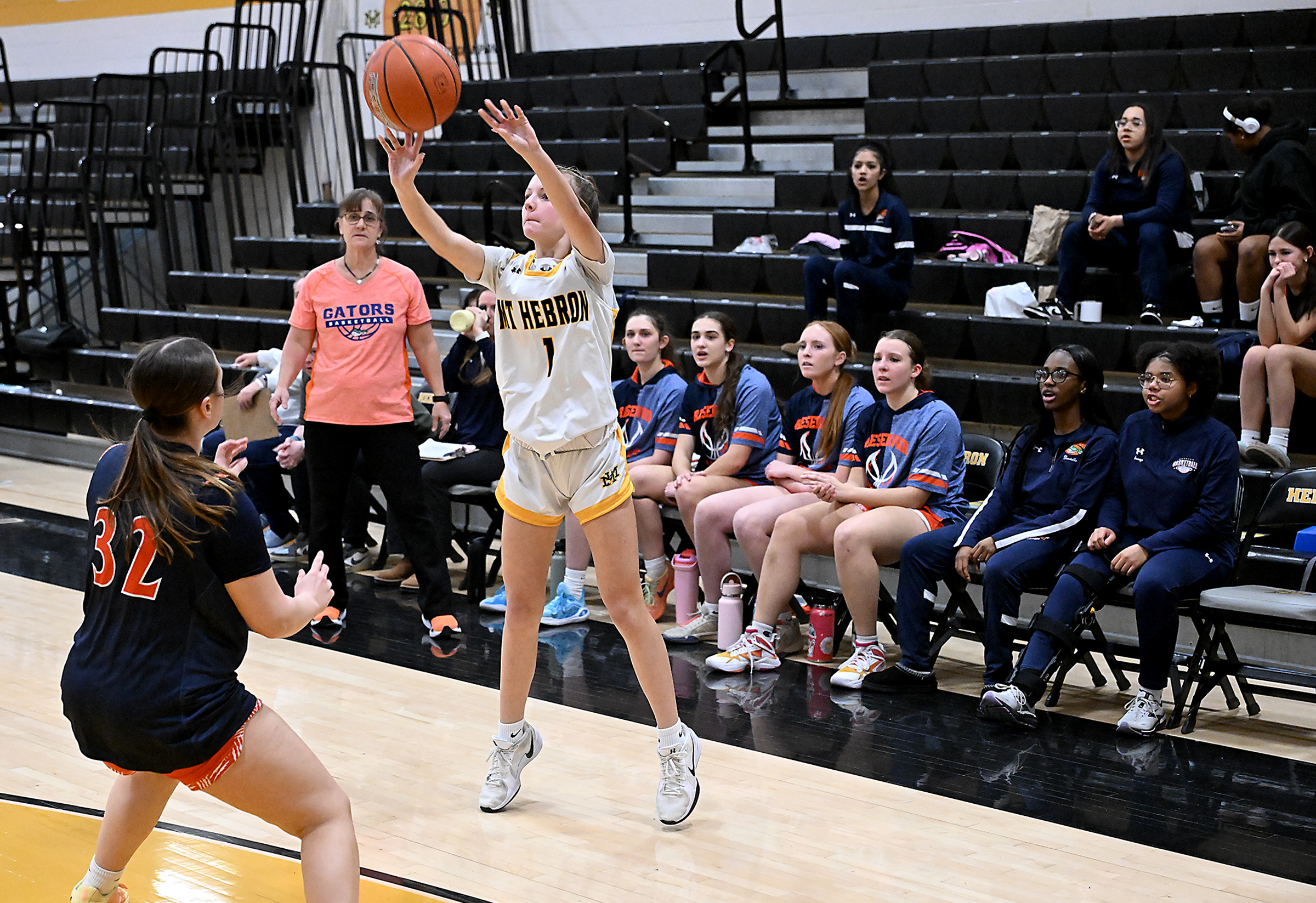 Hebron #1, Quinn Keeton attempts a 3-point shot in the...